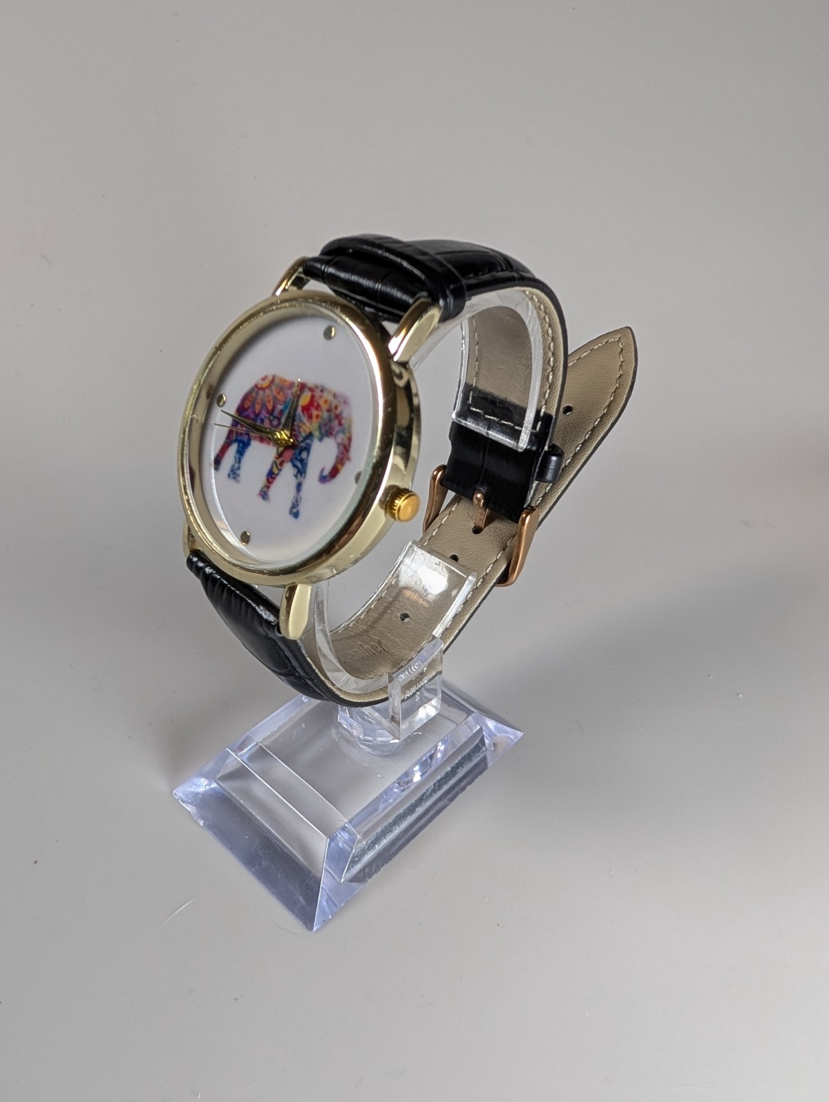 Elephant watch with flower pattern and dot indexes black leather band