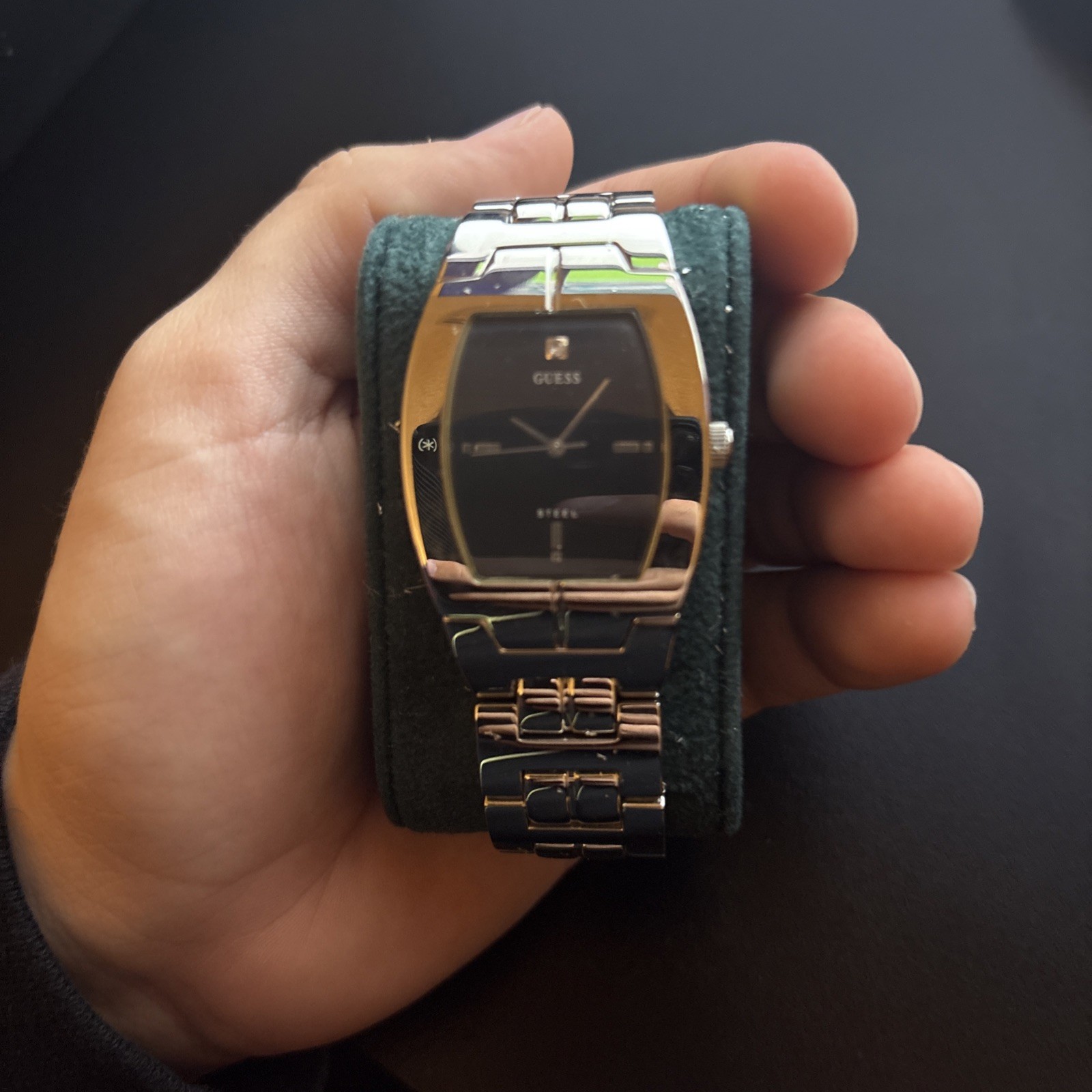 Guess Steel tonneau case, black dial, stainless bracelet. Entry-level