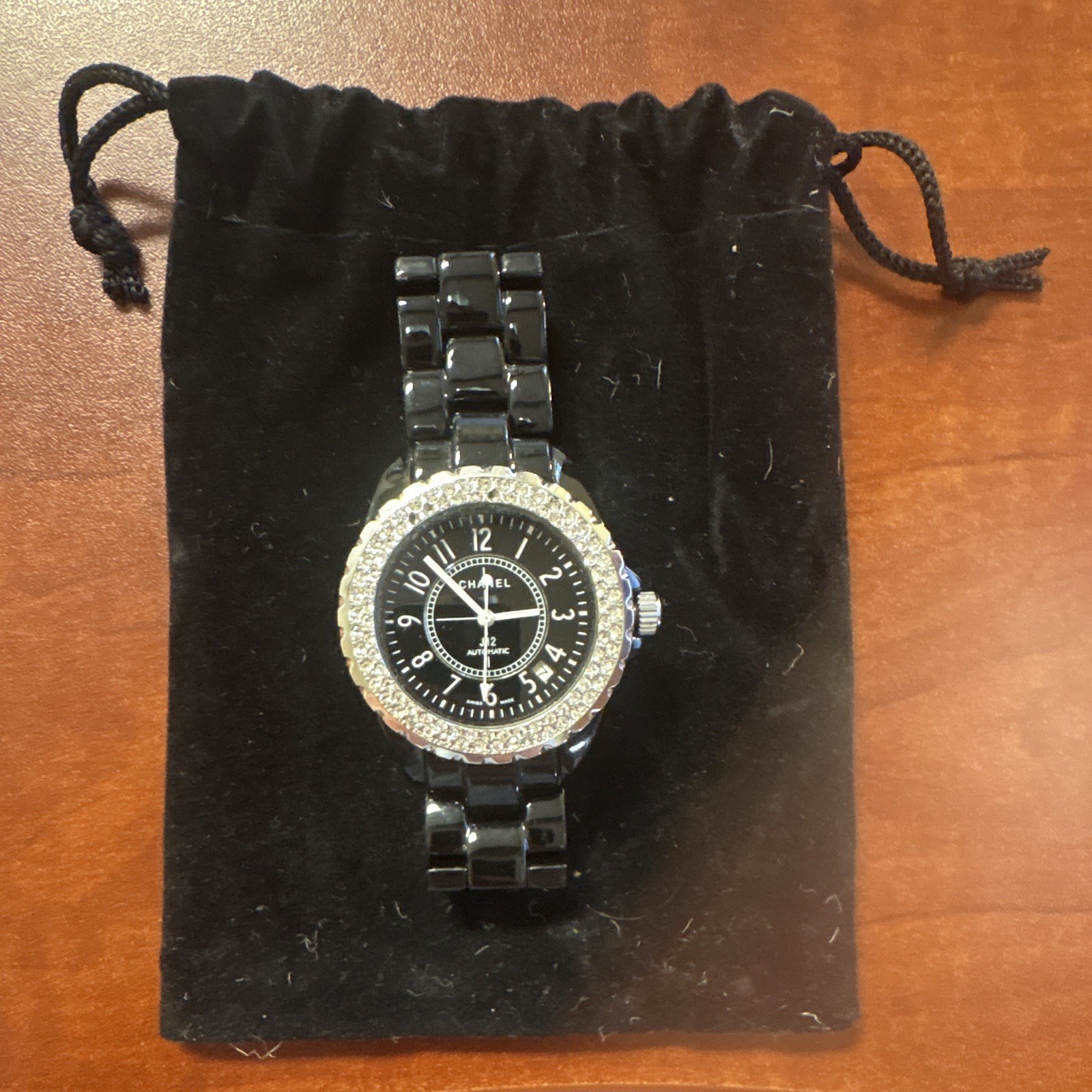 Chanel J12 watch in black ceramic with a diamond-set bezel