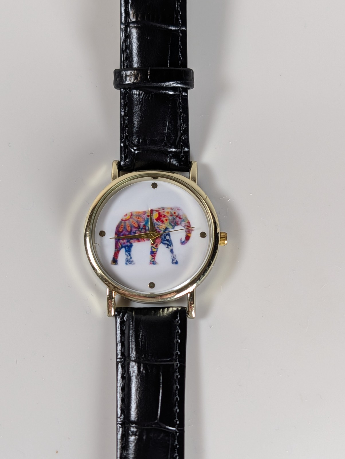 Elephant watch with flower pattern and dot indexes black leather band