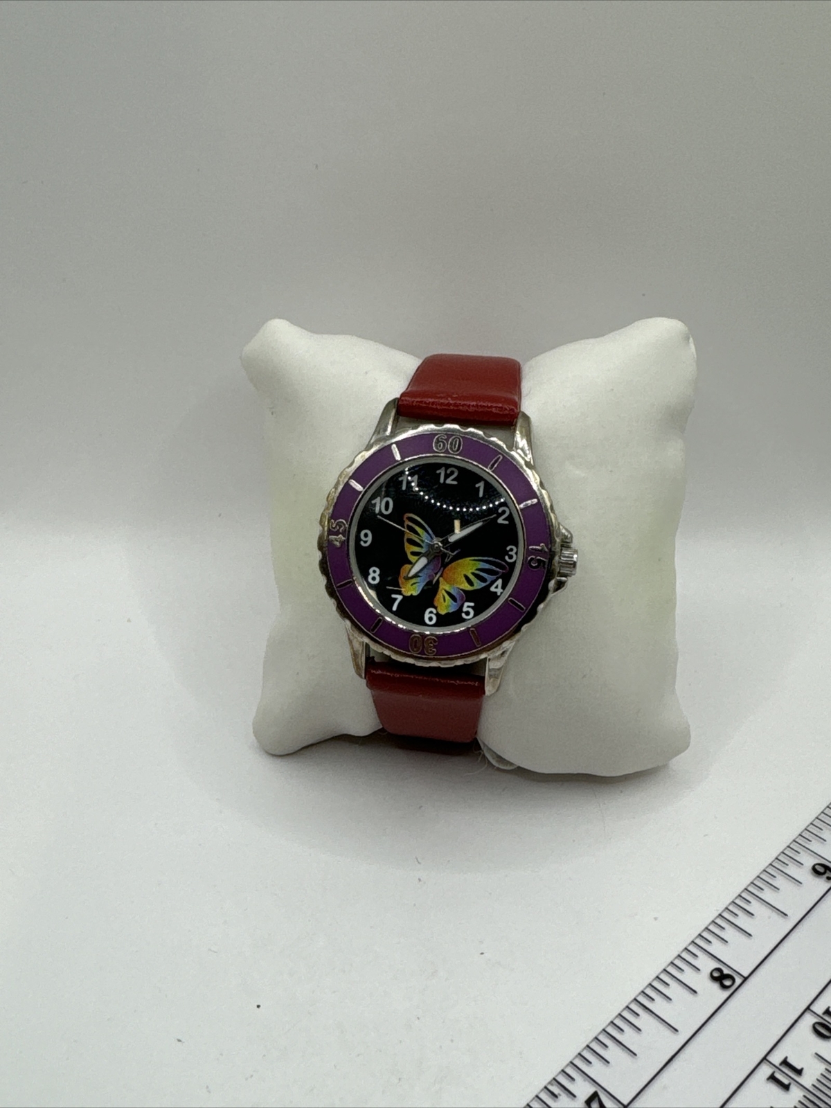 Unbranded ladies watch.butterfly on dial,leather band with buckle
