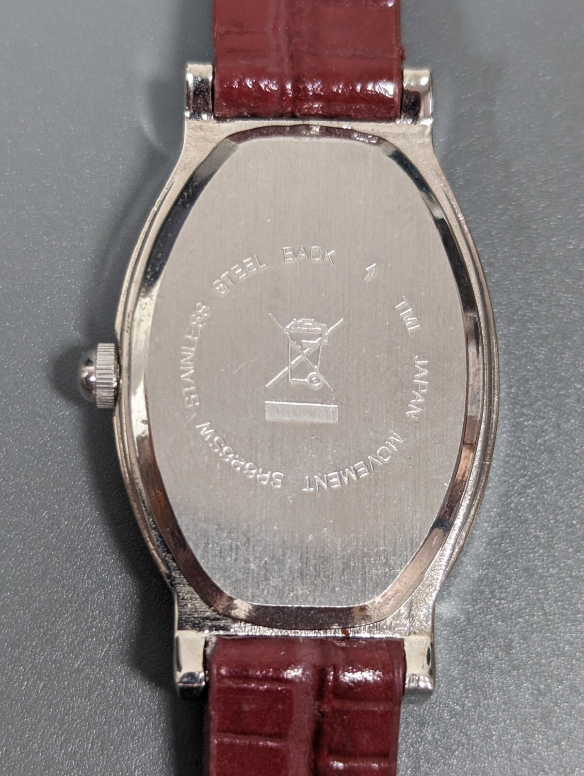 Black Dial Silver Tone Oval Case Red Leather Band Watch