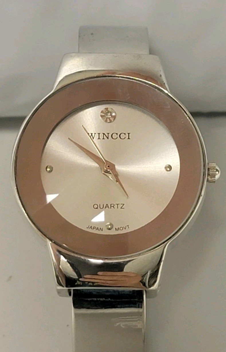Wincci Analog Wristwatch with Spring Cuff Band and Quartz Movement
