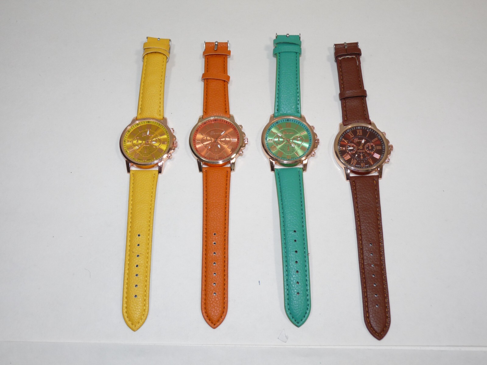 4 Geneva Women’s Watches Varied Colors Green Yellow Orange Brown