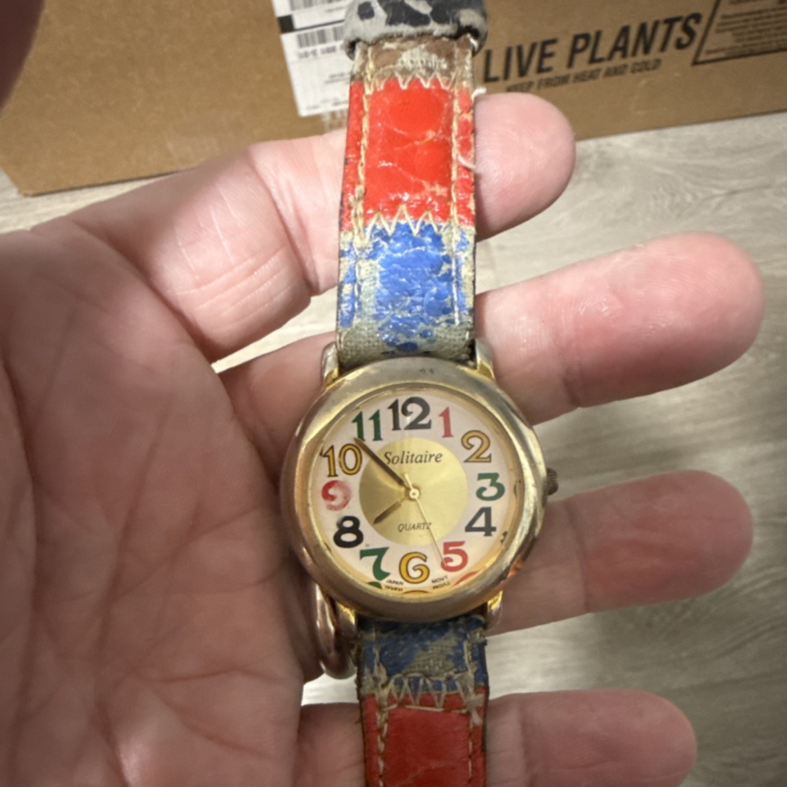 Solitaire Quartz Wristwatch Gold Case Multicolor Dial Leather Band Analog Round