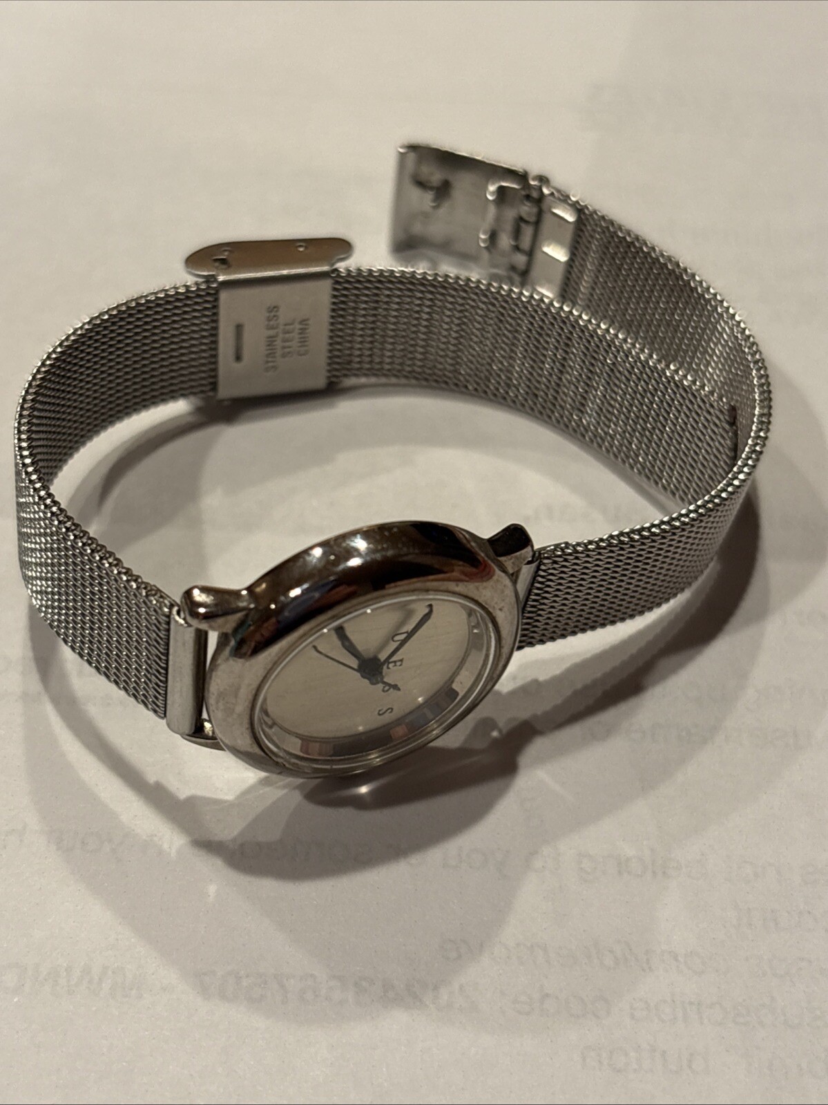 1996 GUESS numberless face watch. silver w adjustable mesh band. new battery.