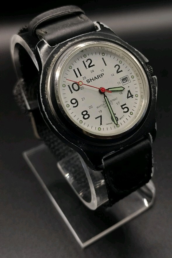 Sharp SHP-1607 Water Resistant to 100 feet Wristwatch. Needs battery.