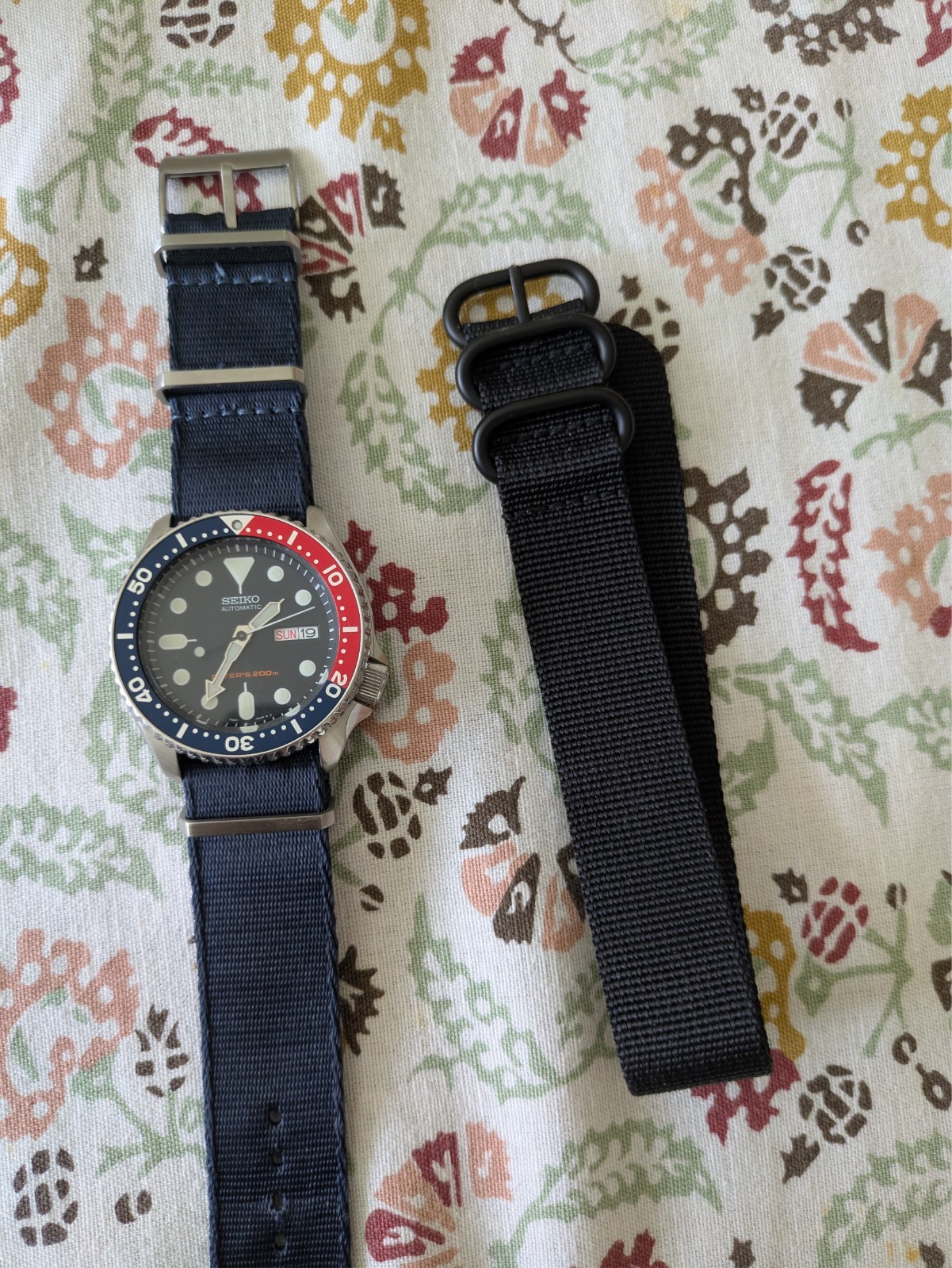 Seiko Men’s Watch – SKX009 on a blue nato plus a black nato strap.