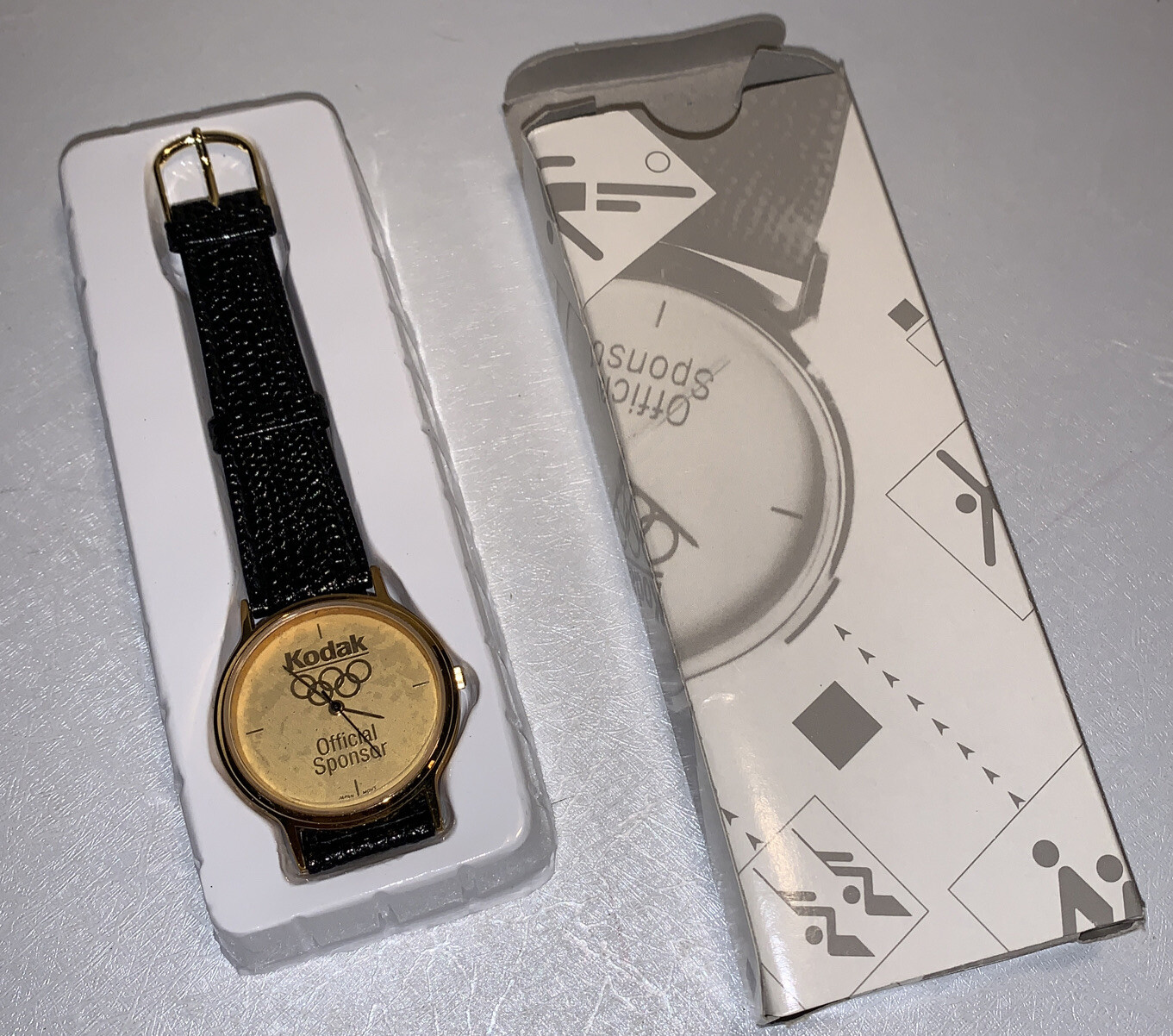 VINTAGE KODAK OLYMPIC OFFICIAL SPONSOR WATCH ORIGINAL BOX BLACK LEATHER NOS