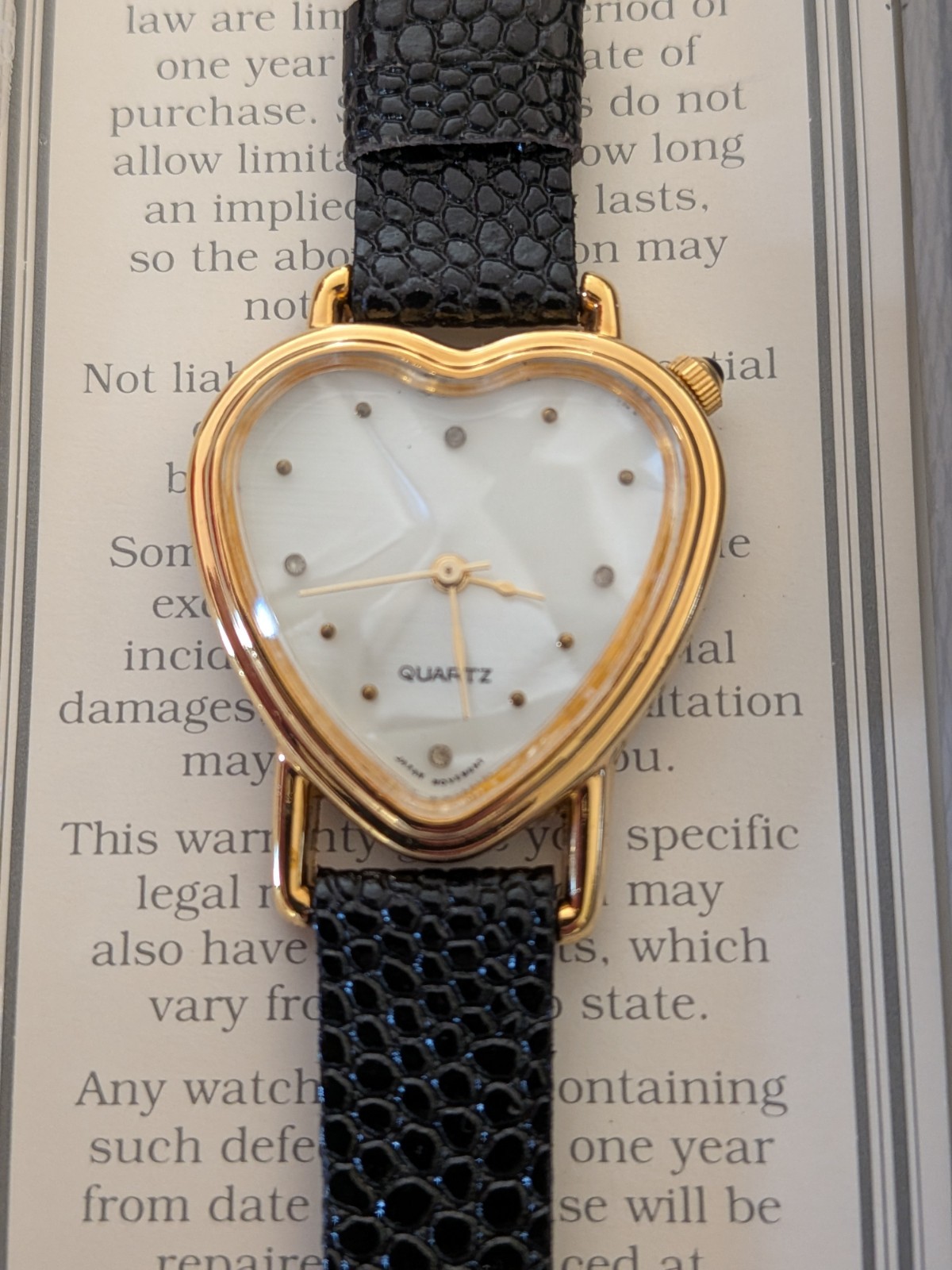 Vtg Avon Heart Shaped Watch Womens 28mm White Dial Gold Tone Black Strap Quartz