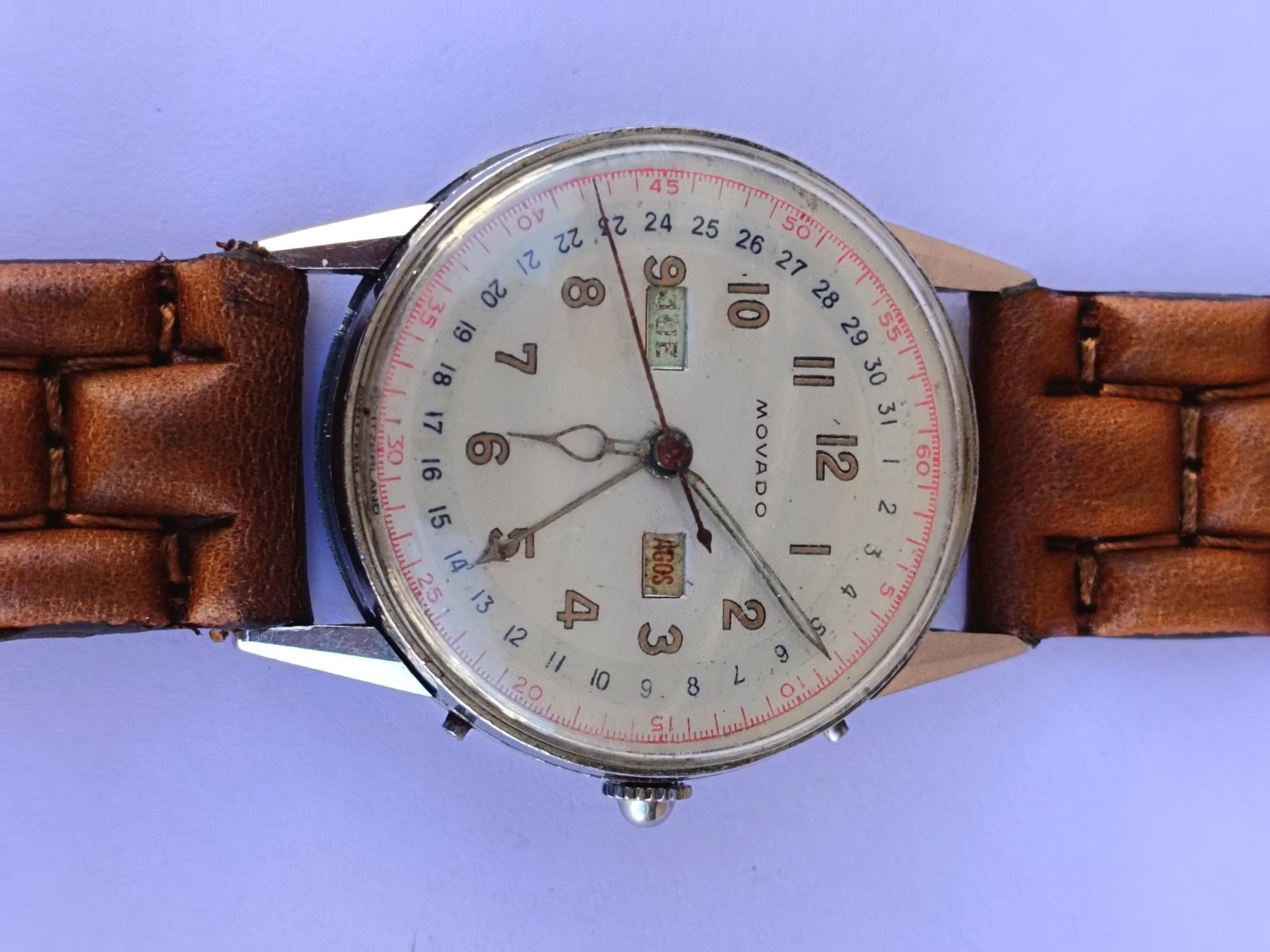VINTAGE MOVADO TRIPLE DATE. MANUAL WIND. MULTICOLOUR DIAL. RUNNING