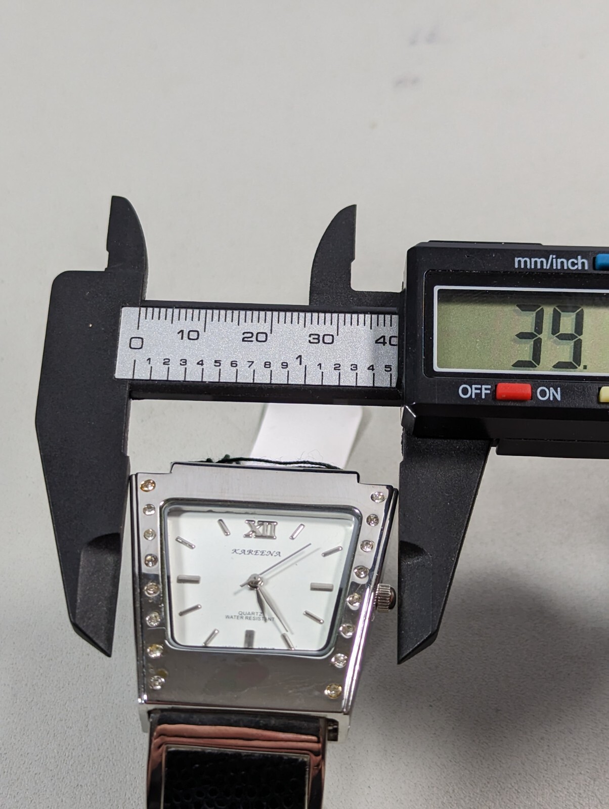Kareena White Dial Silver Tone Case Black Silver Tone Open Cuff Hinge Band Watch