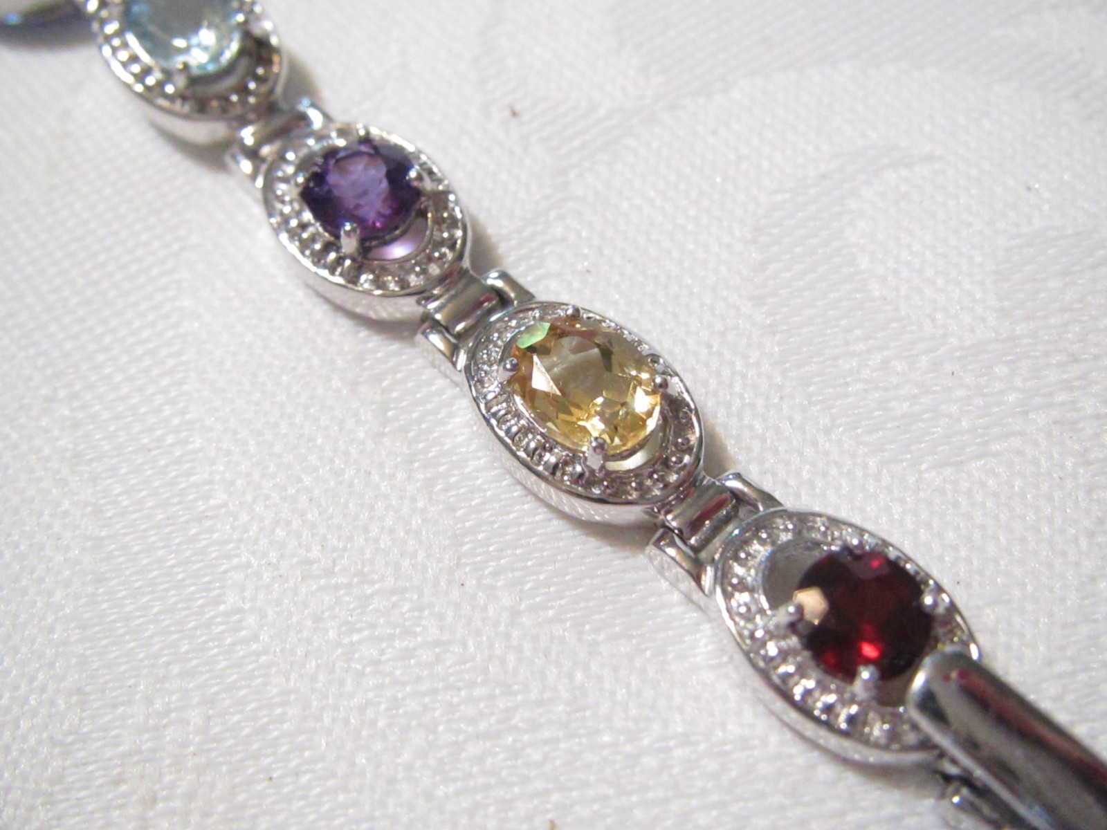 BEAUTIFUL STERLING SILVER MULTI GENUINE GEMSTONES 7 1/4″ QUARTZ WATCH – 29.6 GR.