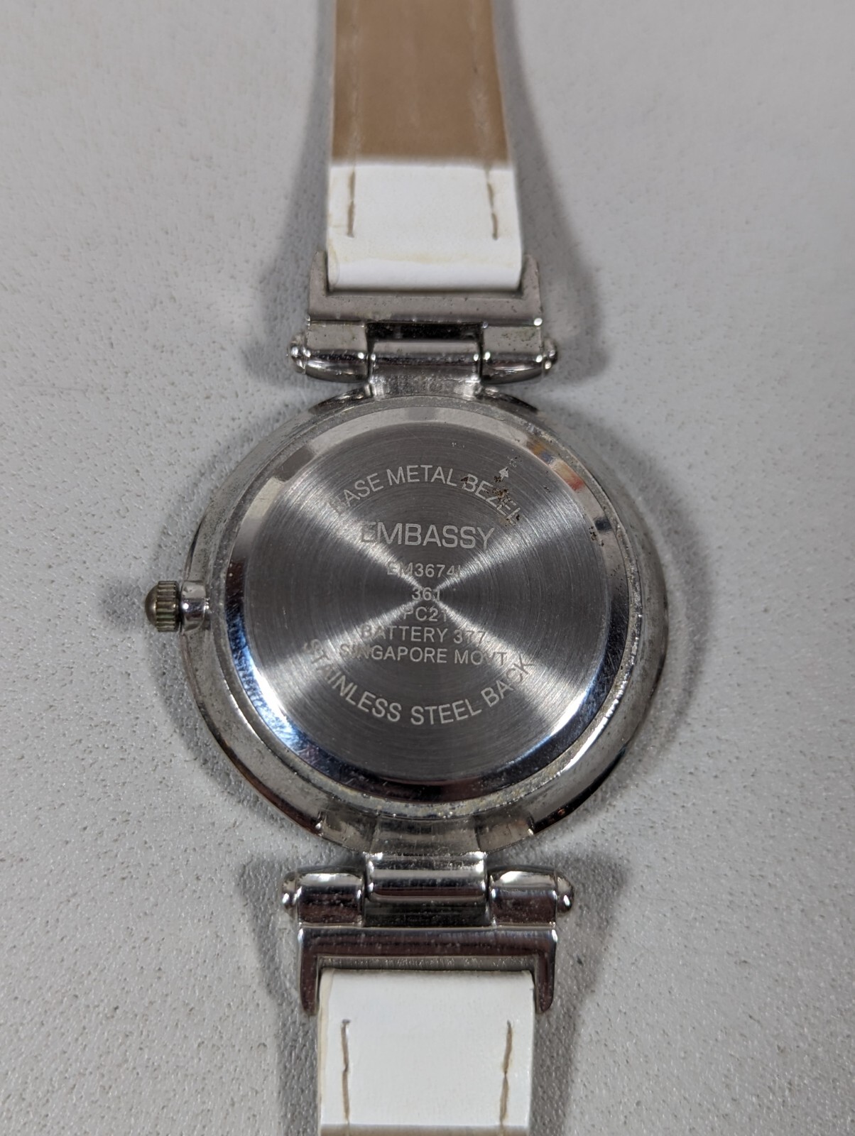 Embassy Womans White Pearlized Dial Silvertone Round Case White Band Watch 7.5in