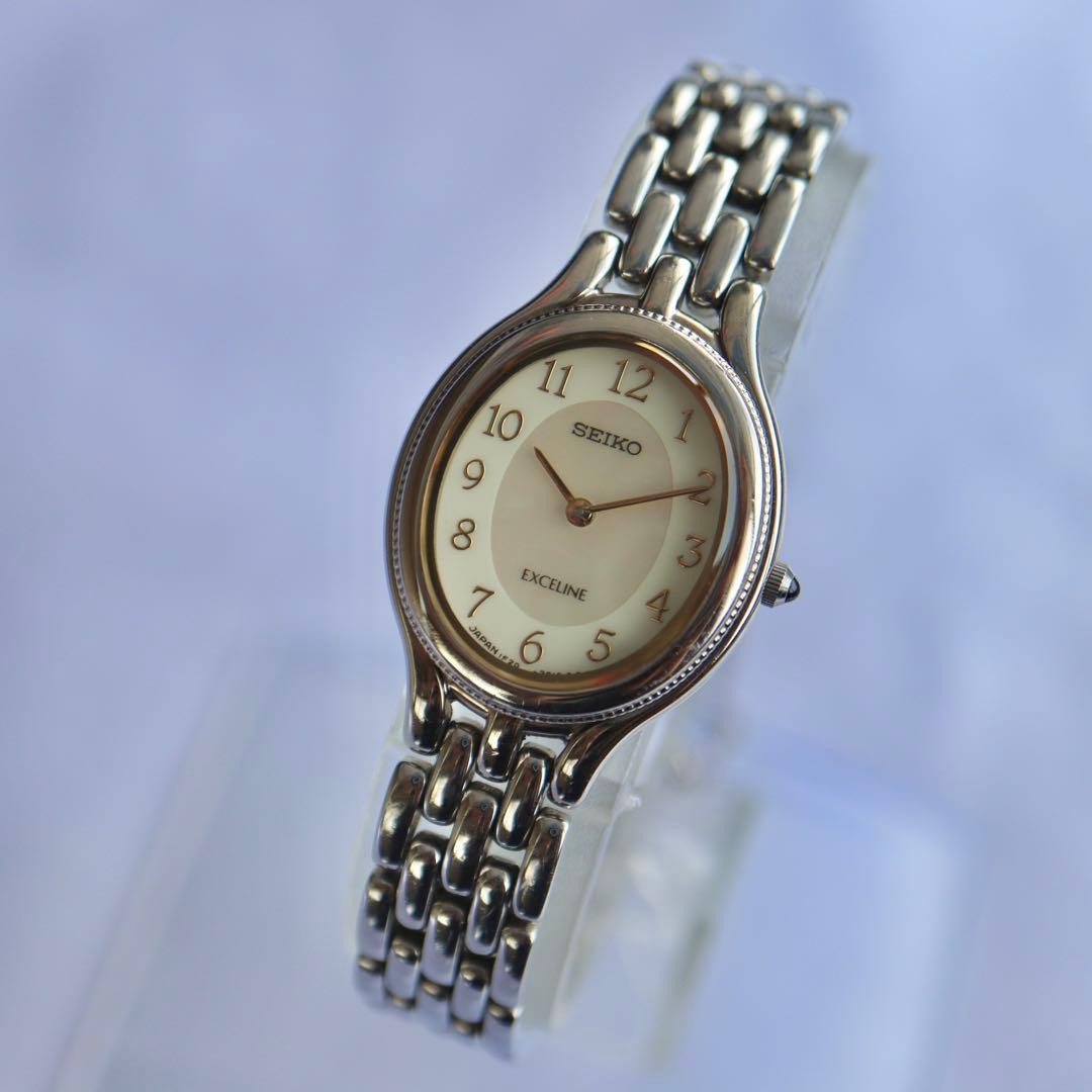 SEIKO Exceline Oval Pink Shell Silver Watch 1676