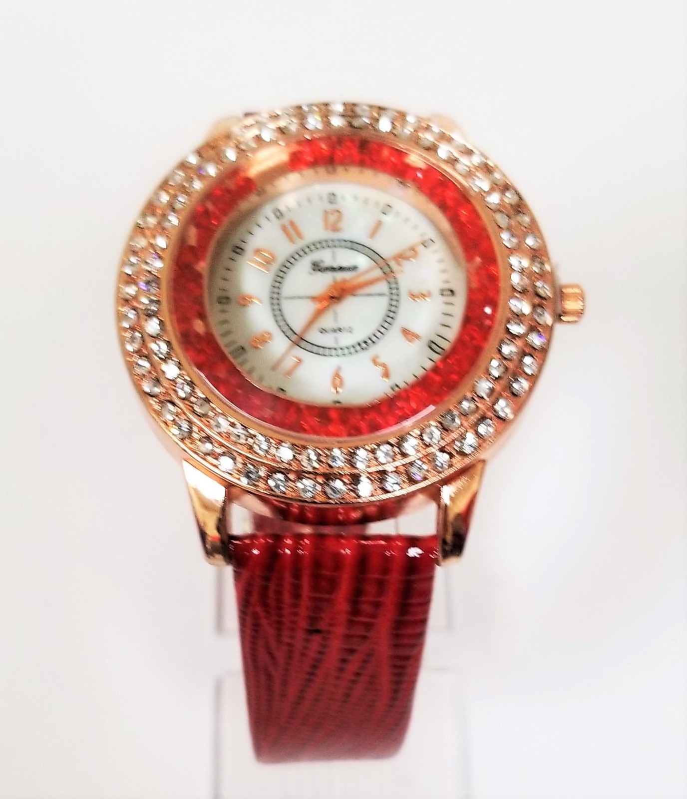 NEW GENEVA ROSE GOLD TONE,MOVING CRYSTALS,WHITE MOP DIAL,LEATHERETTE BAND WATCH