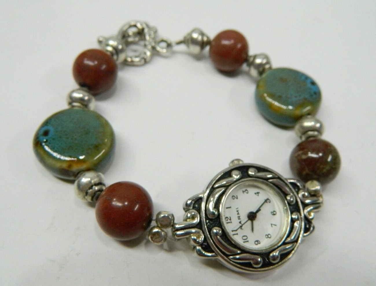 Beautiful NARMI Silver tone Multicolor stone lady’s wristwatch/watch