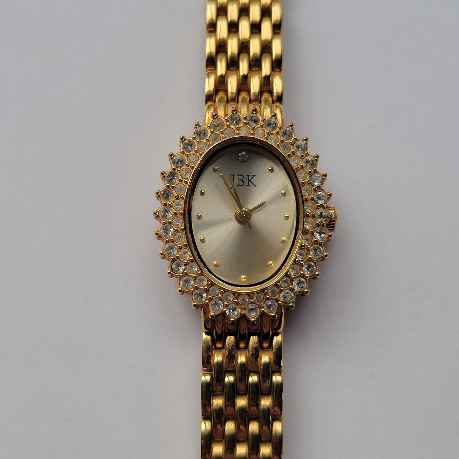 JBK Womens Gold Oval Elegant Dress Watch Gemmed Bracelet Quartz Jewelry Clasp
