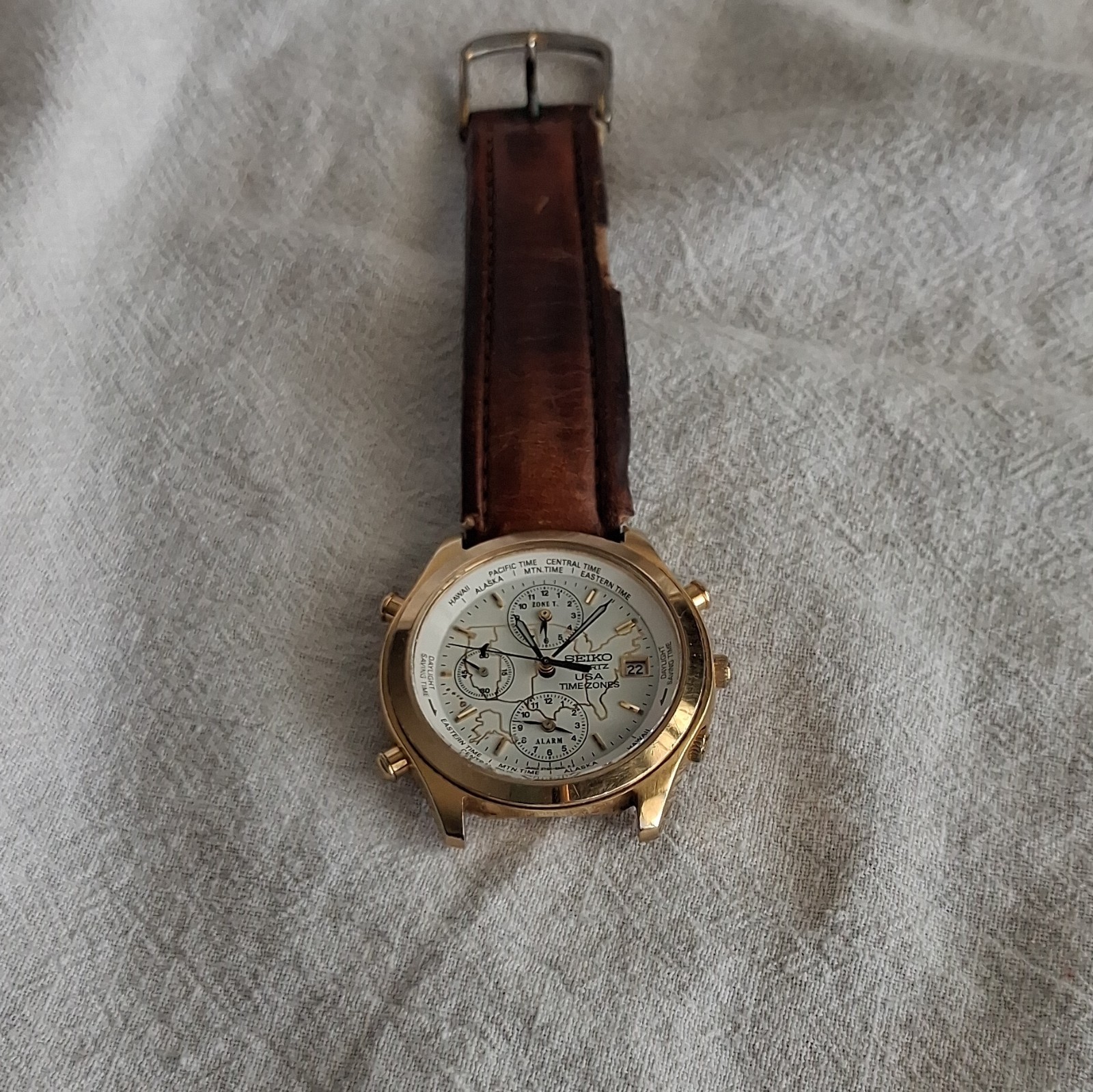Seiko USA Time Zones Quartz World Time Alarm Date Gold-Tone Leather Band