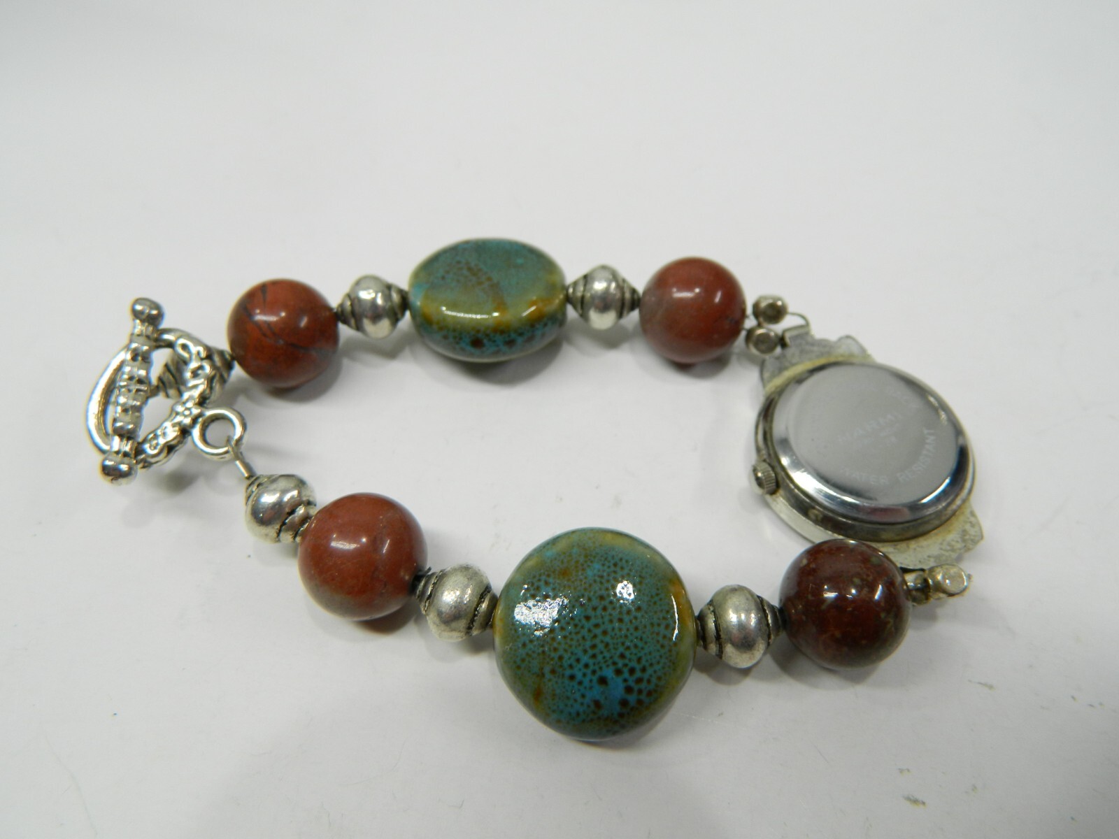 Beautiful NARMI Silver tone Multicolor stone lady’s wristwatch/watch
