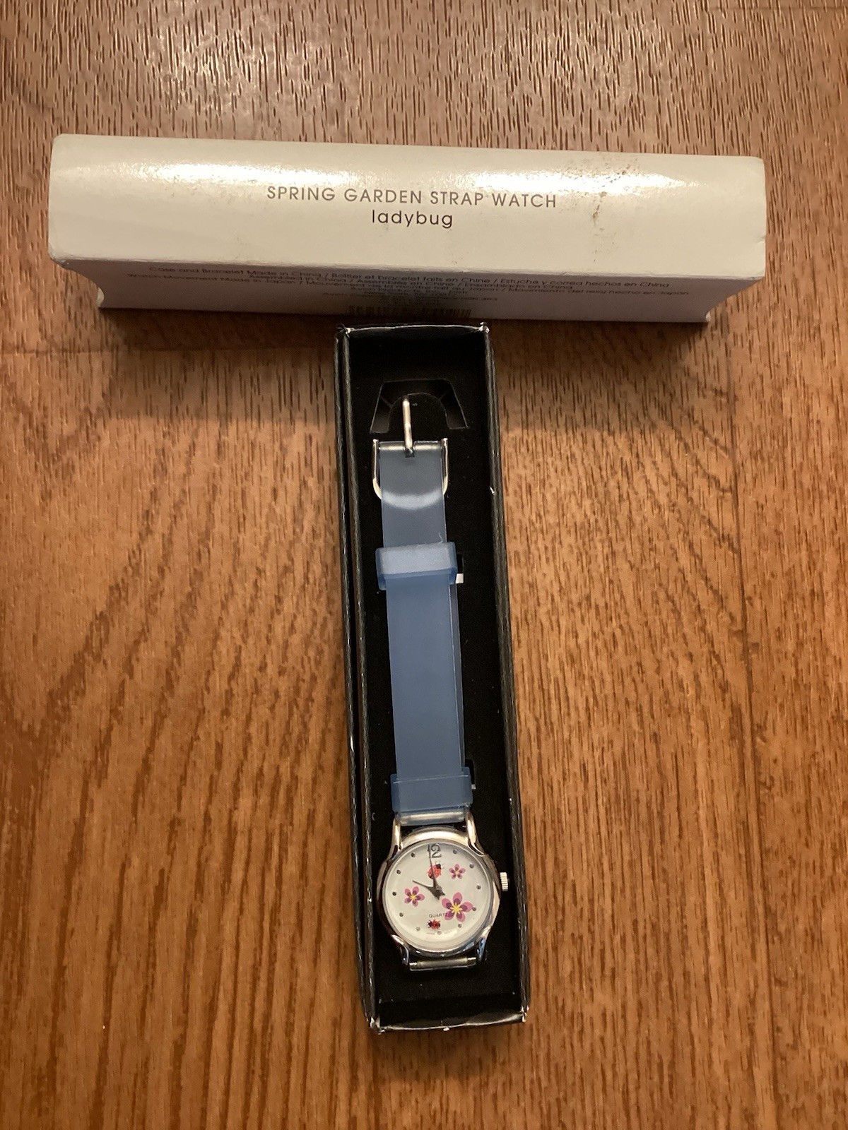 NIB Vintage Avon Spring Garden Ladybug Blue Translucent Wristwatch.