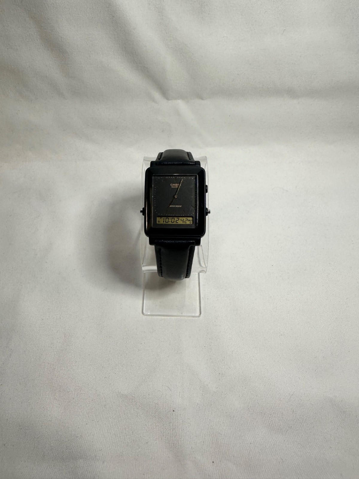 VINTAGE CASIO AQ-30 black face with gold accent leather band