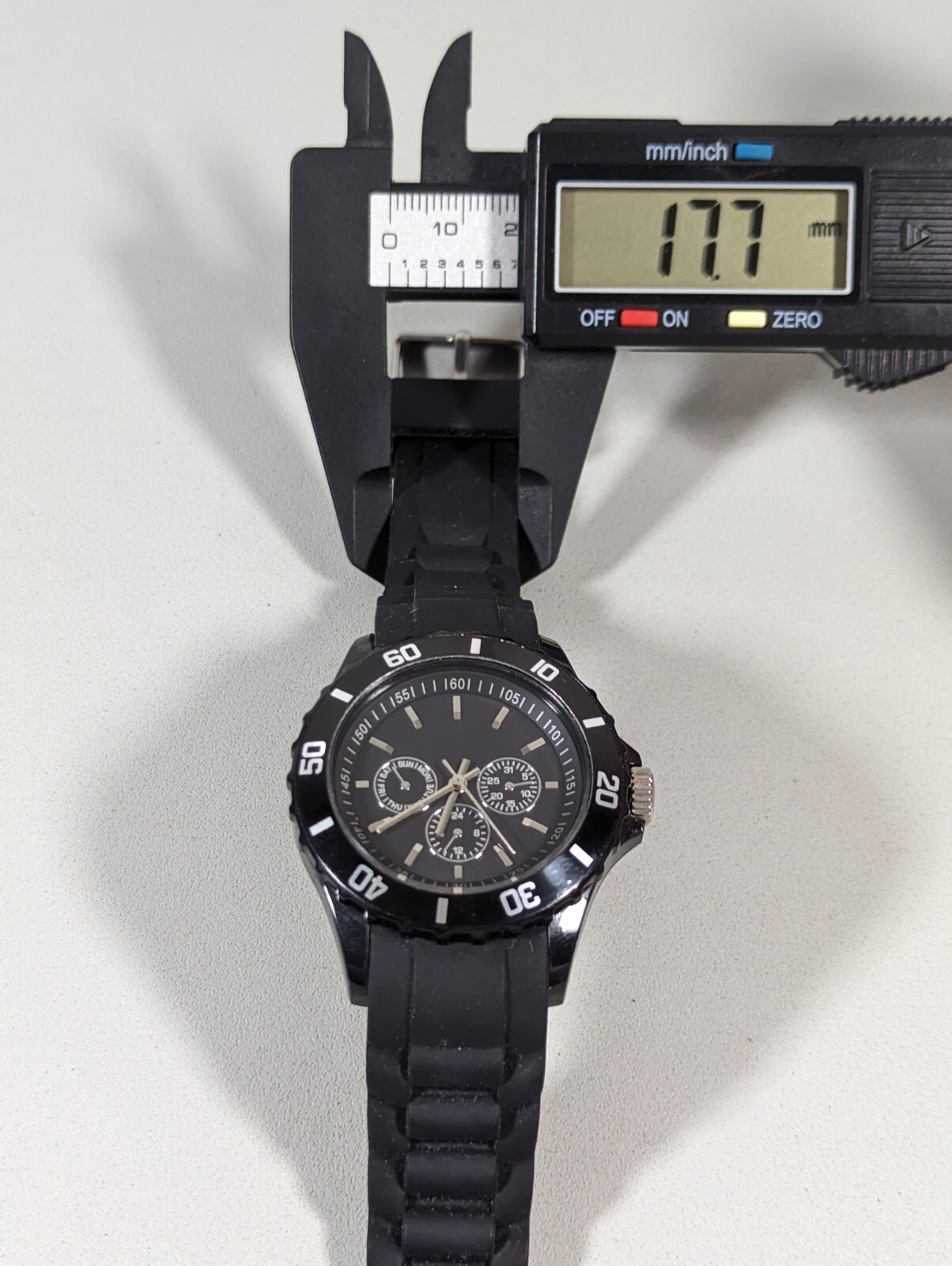 Black Dial Rotating Bezel Round Case Black Silicone Band Watch