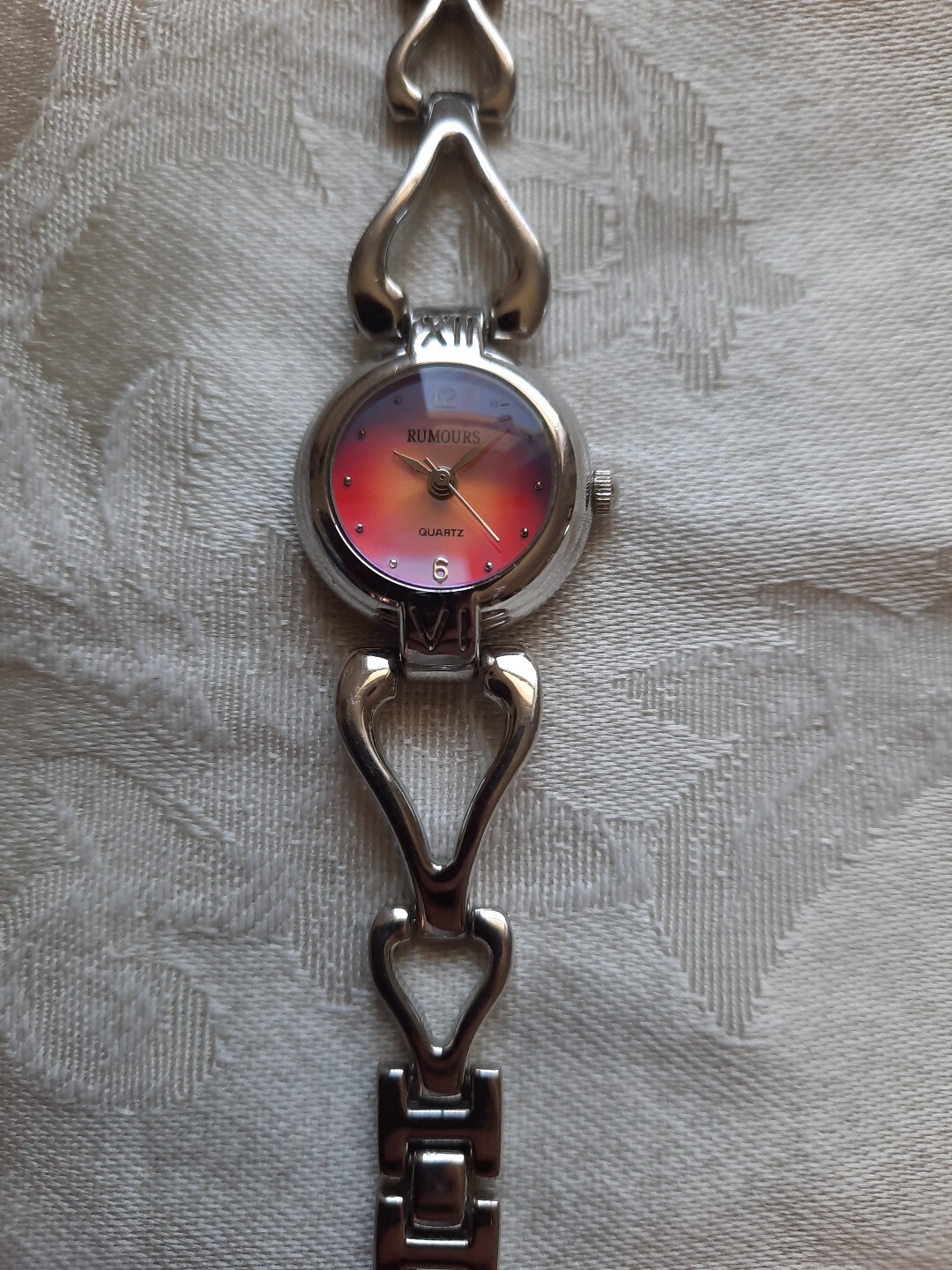 Rumours elegant pink dial with silver geometric watch new battery