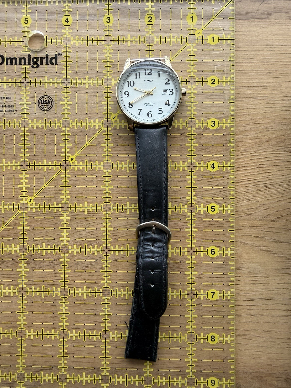 Timex Indiglo Quartz White Dial Arabic Date Gold Tone Case Black Leather 50m