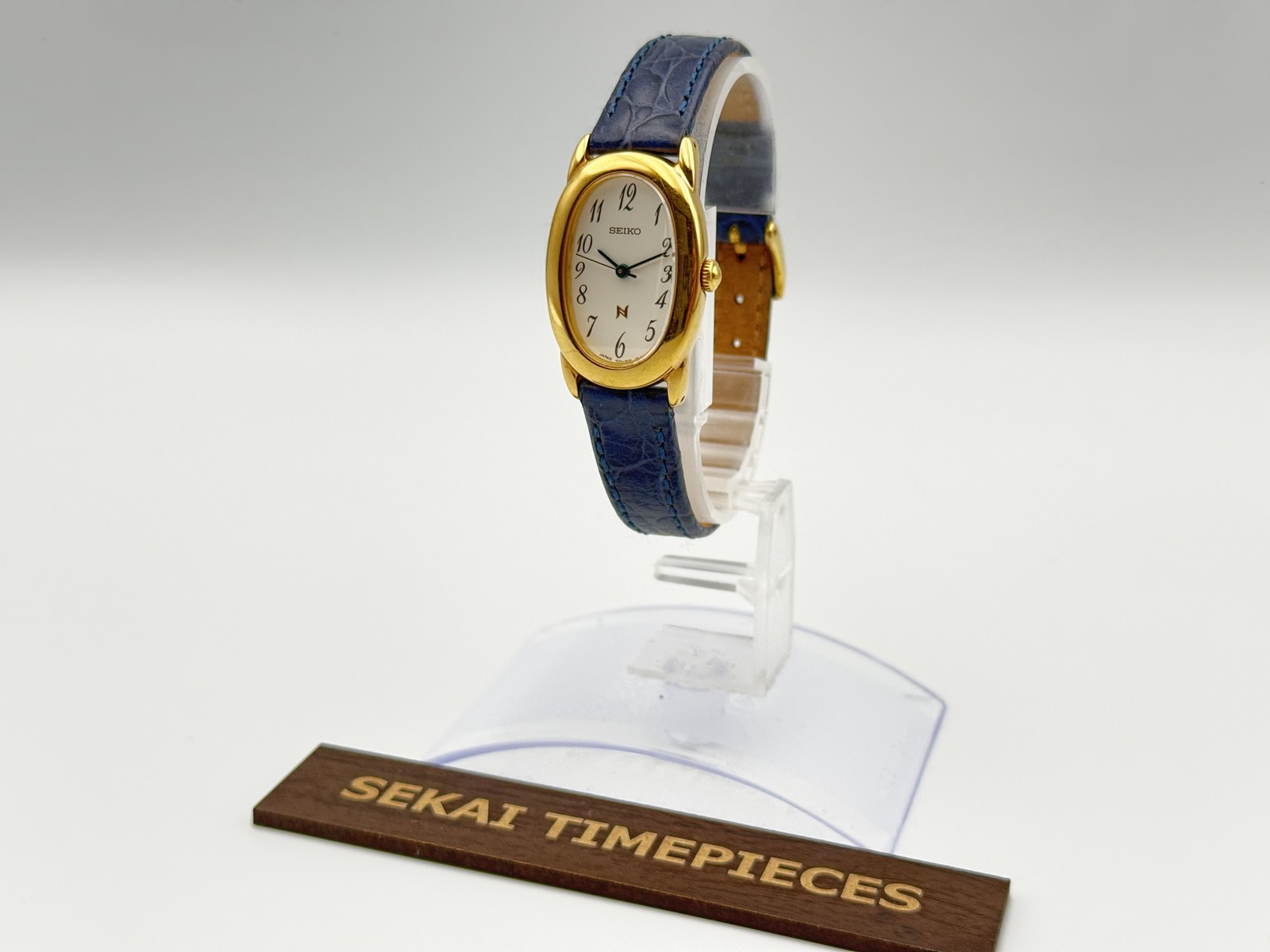 SEIKO Noie 1F21-5B70 Vintage Gold Oval Quartz Cream Dial Blue Hands Ladies Watch