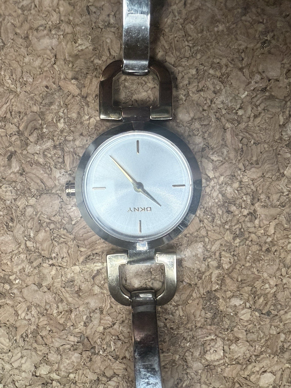 DKNY Women’s Analog Silver Metal Bracelet Wristwatch Round Face Baton Indexes