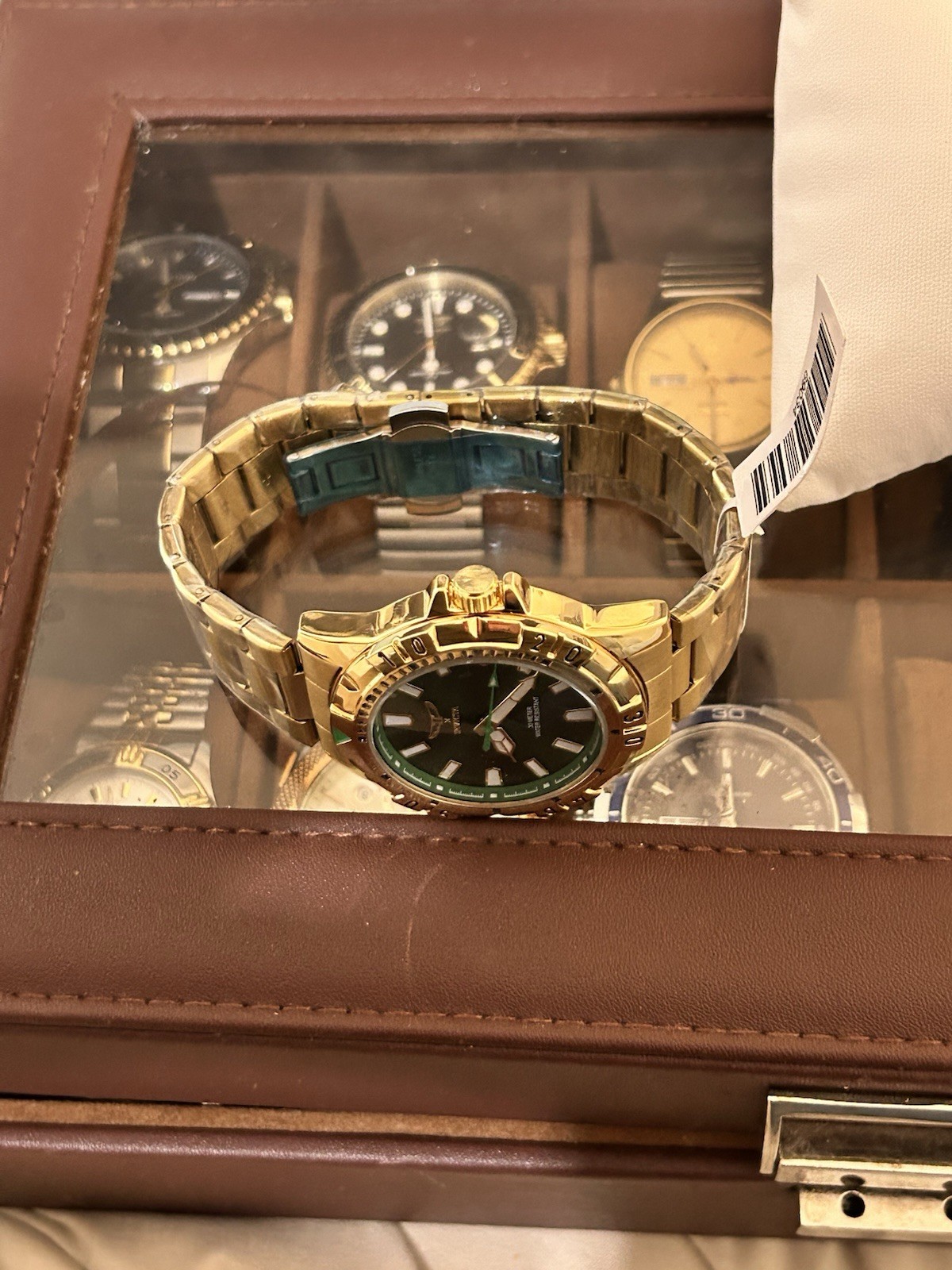Invicta Specialty men’s watch (model 69034) a 42mm gold tone case green dial