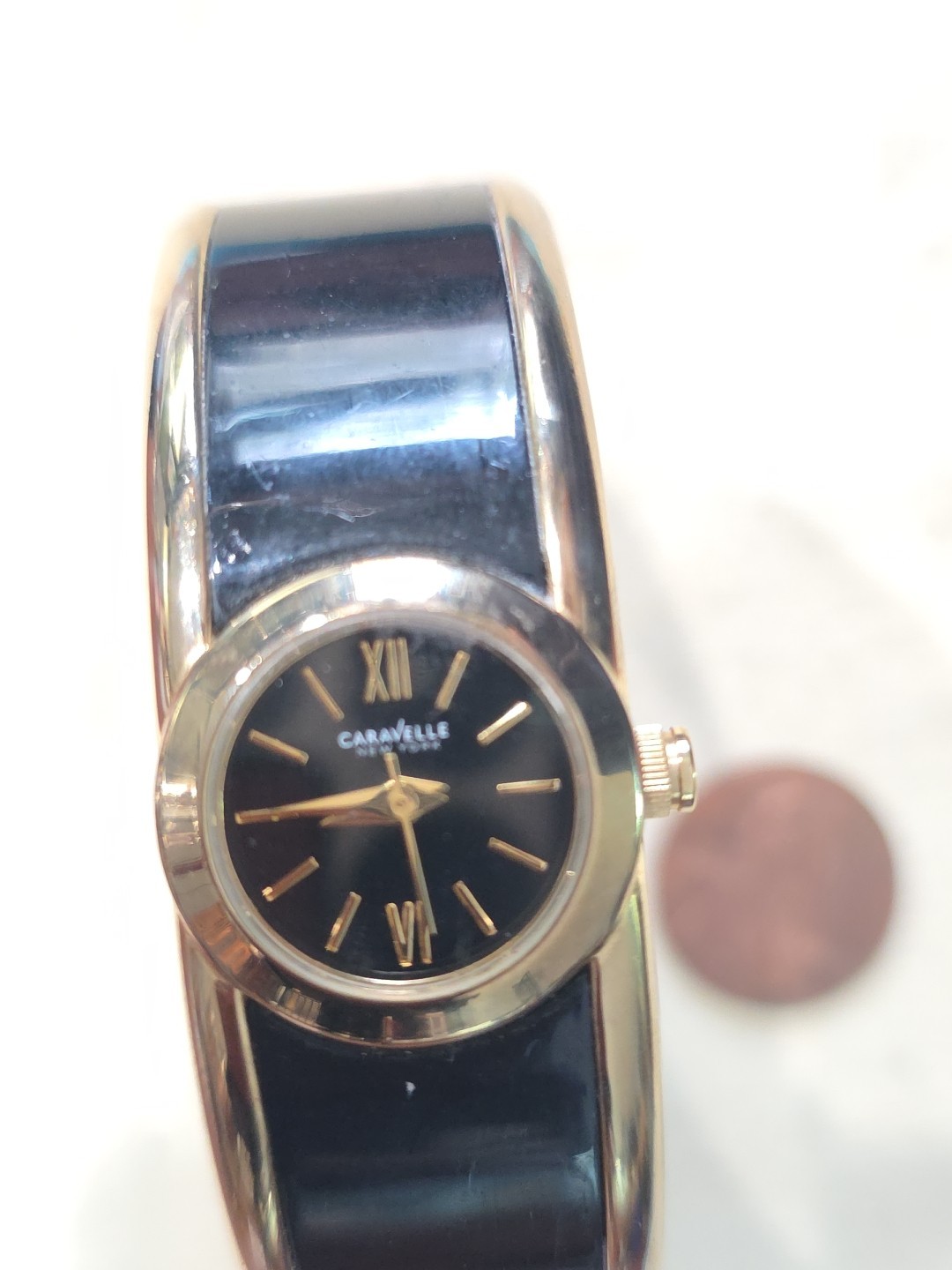 Caravelle New York 44L147 Women’s Gold Tone/Black Bangle Roman Analog Watch Runs