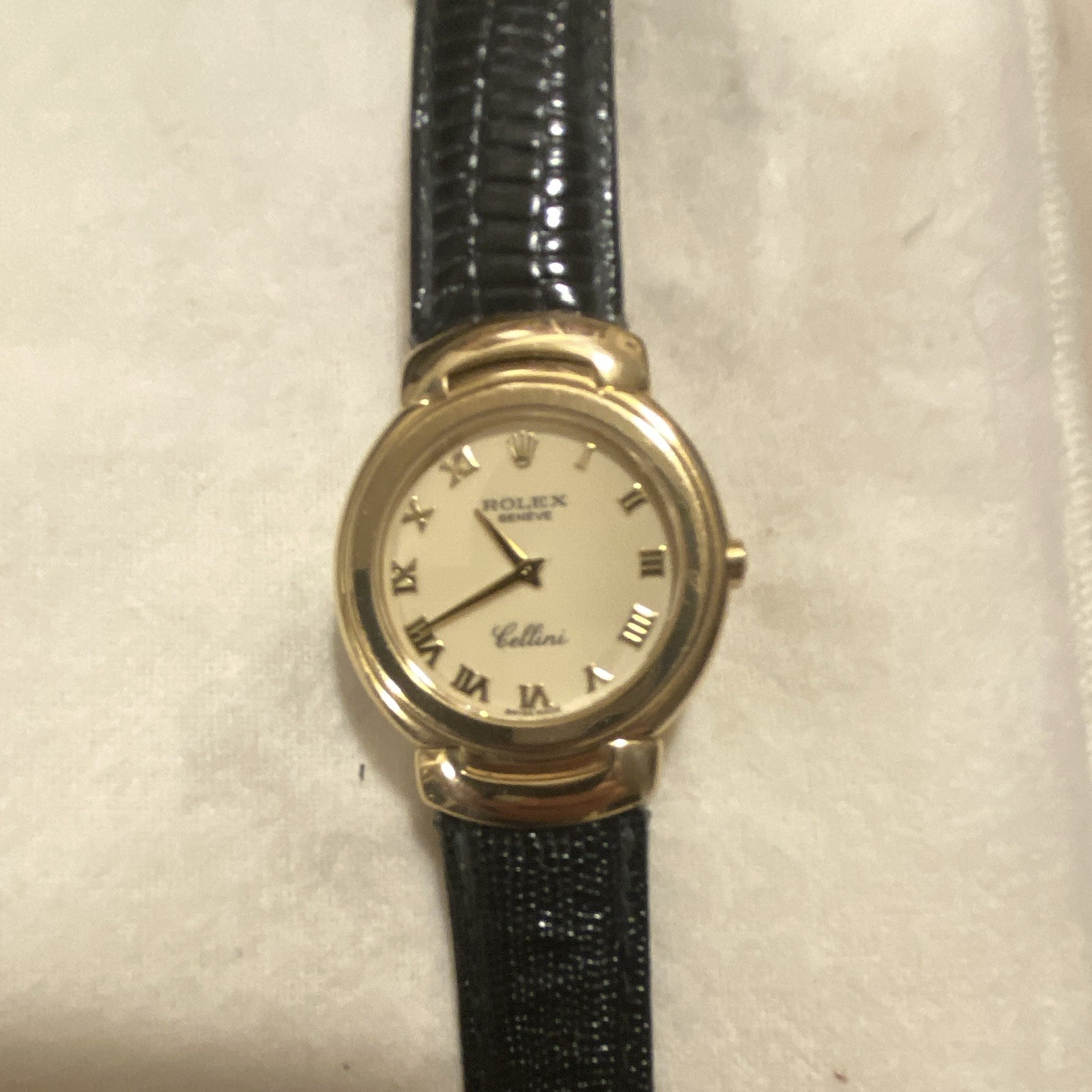 Rolex Cellini Women’s Quartz White Roman Dial Yellow Gold Case Black Strap Box.