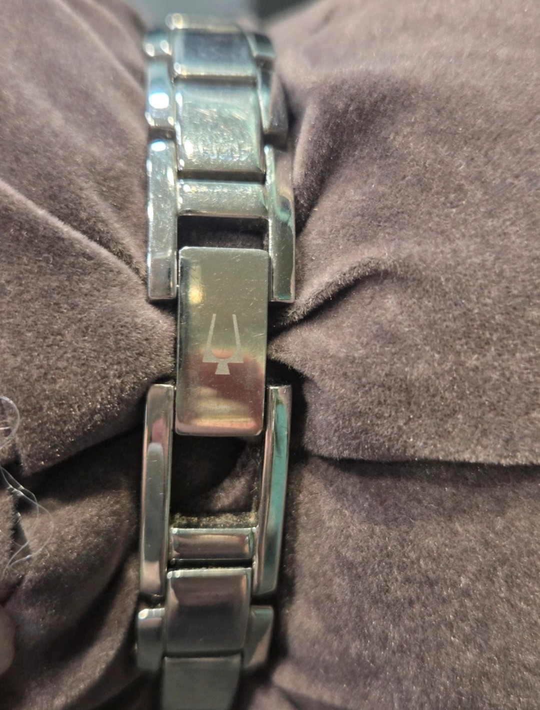 Bulova silver watch with rectangular face and diamond accents