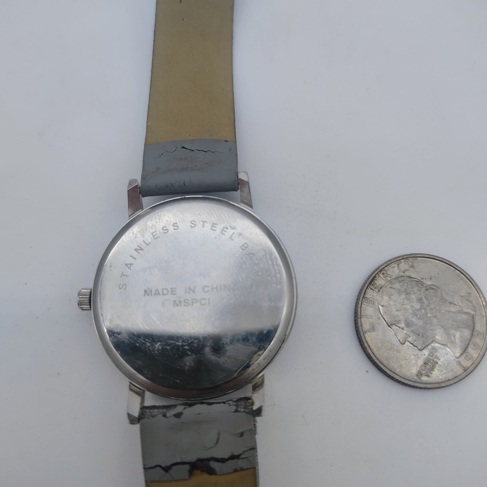 Silvertone Bezel Gray And White Striped Dial Gray Band NEW BATTERY