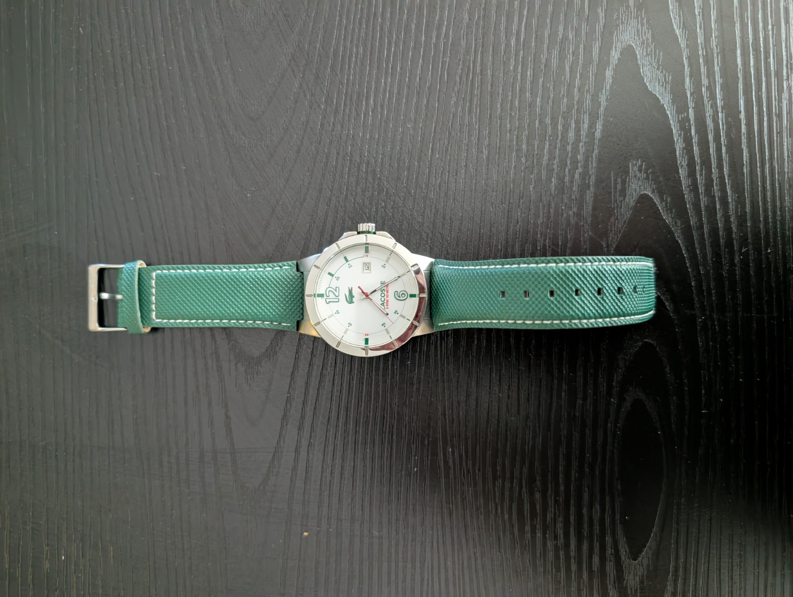 Lacoste watch men pre-owned / White with green leather band