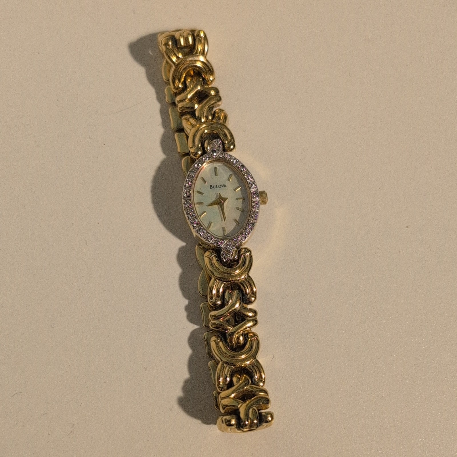 Bulova Quartz Women’s Oval White Dial Diamond Accent Gold Tone Bracelet Watch