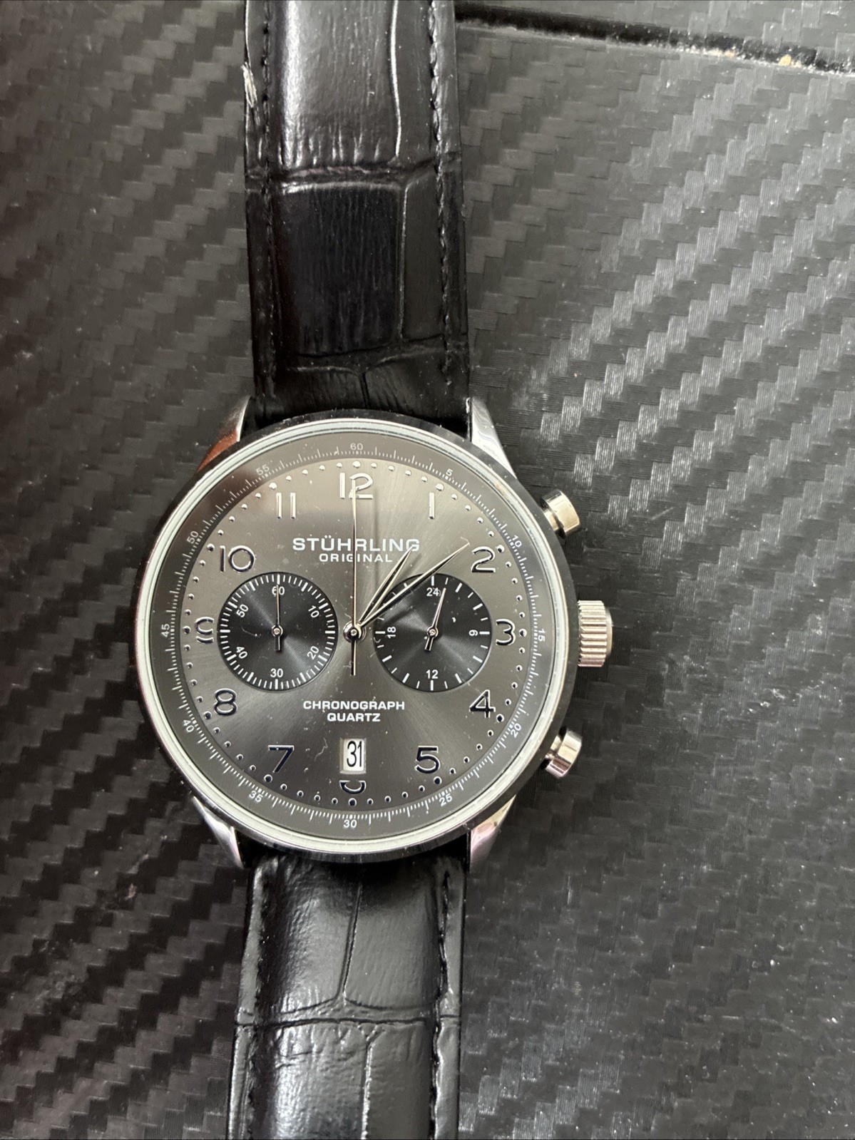 stuhrling original , water resistant, 2 years manufacturer Warranty