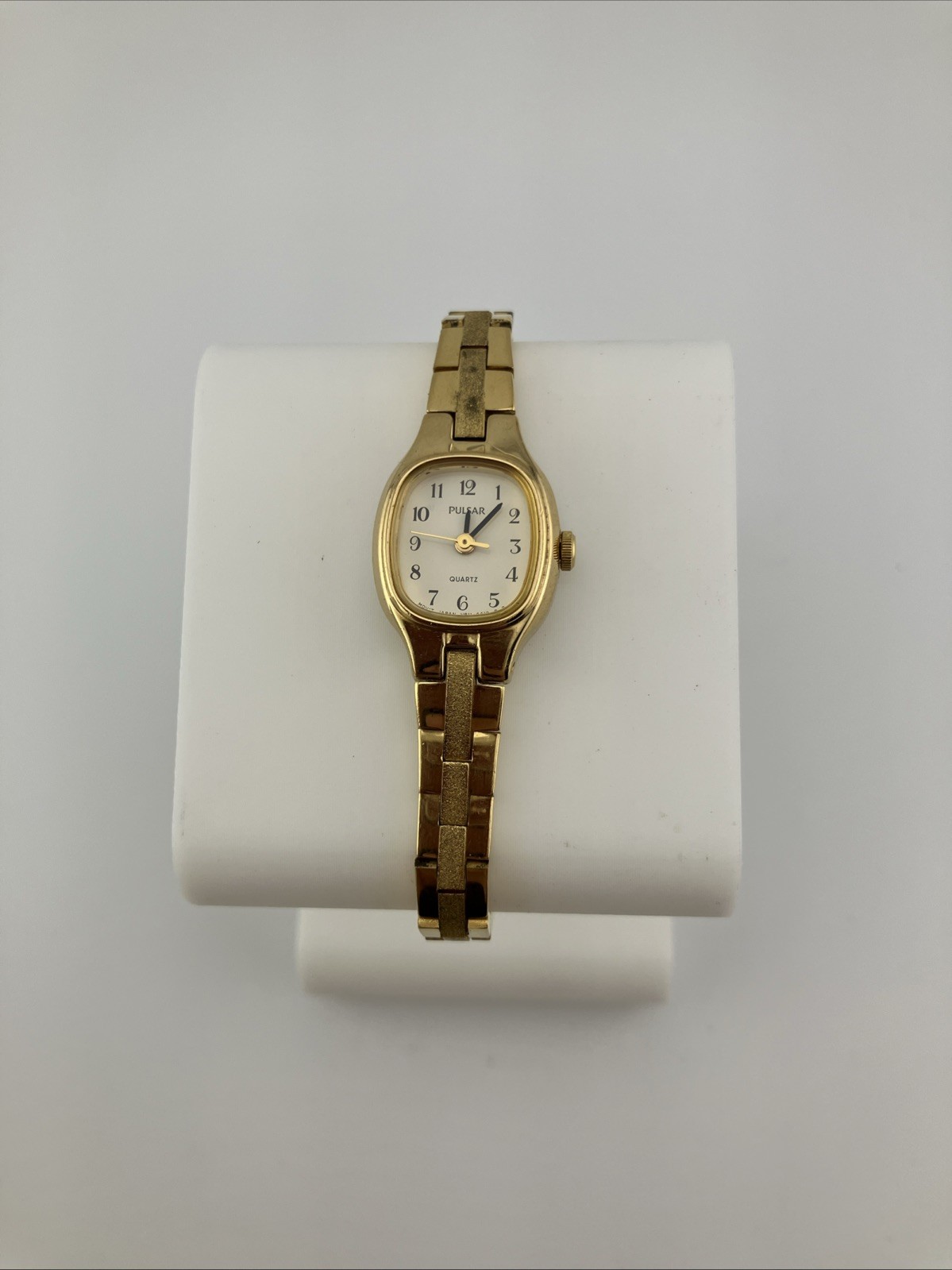 Vtg Pulsar Ladies 16mm Dainty Watch Gold Tone White Dial 6.25″ V811-5300 -RUNS