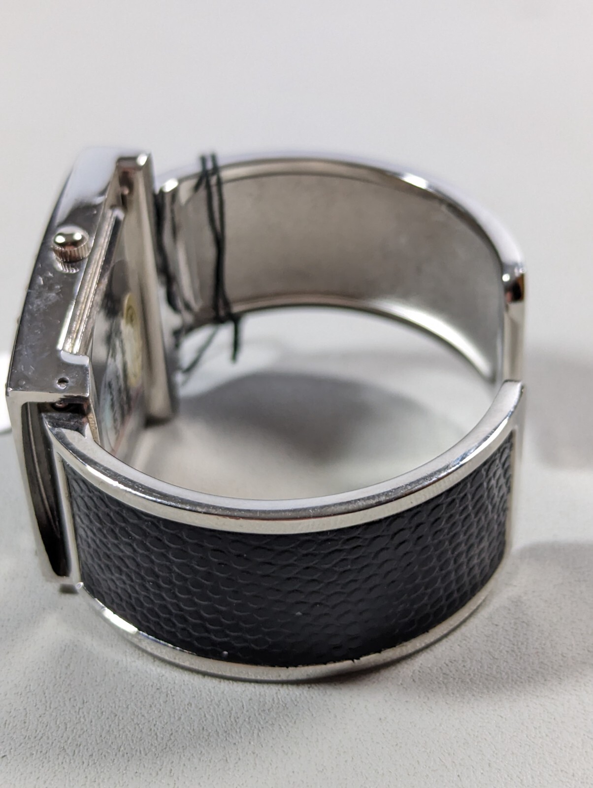 Kareena White Dial Silver Tone Case Black Silver Tone Open Cuff Hinge Band Watch