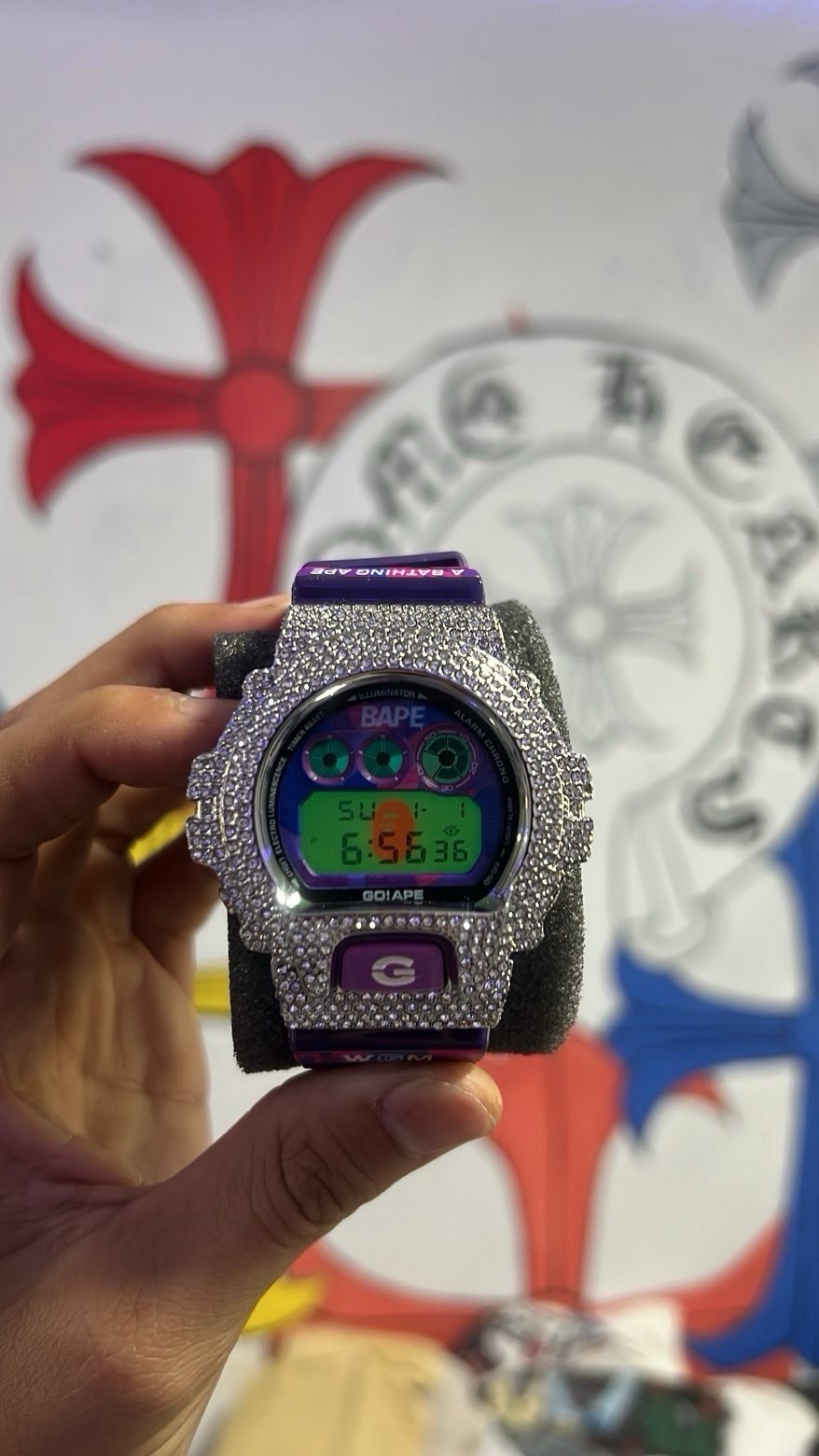Iced Out Bape Collab G Shock with purple and pink camoflauge pattern