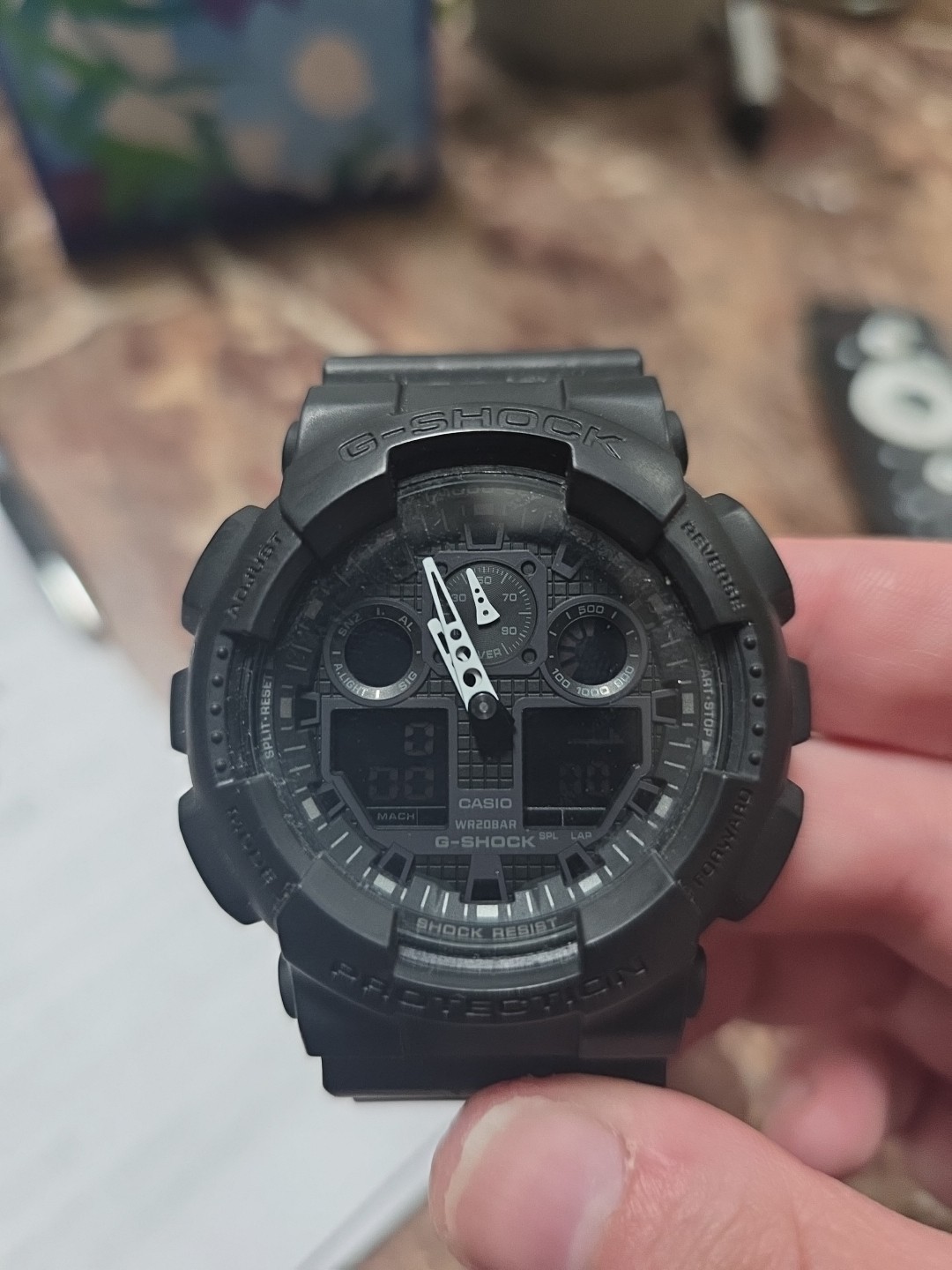 Casio G-Shock GA100-1A1 watch with a black resin band.