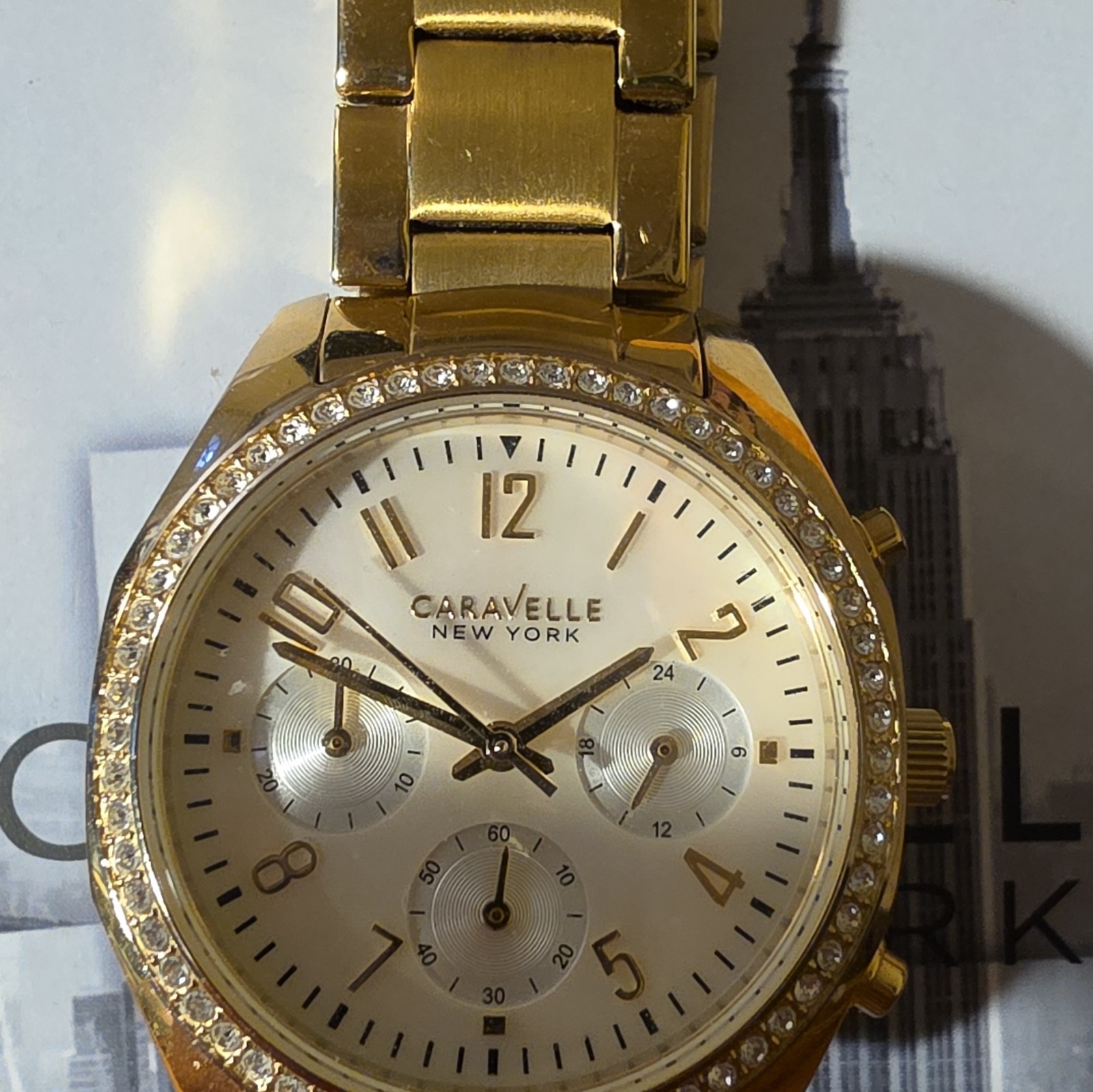 Caravelle New York Women’s Gold Tone Quartz Watch Crystal Bezel Bracelet