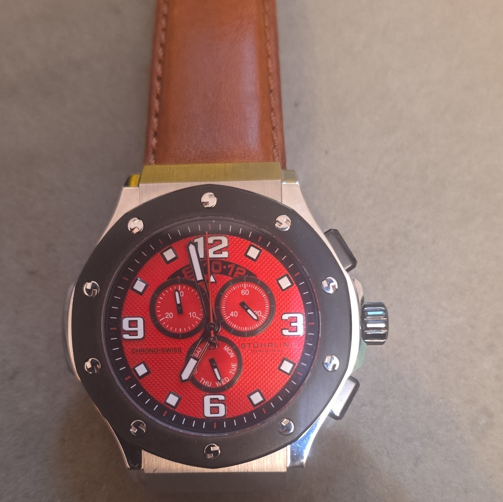 Stührling Original Apocalypse Chrono Grand watch 53mm silver case and red dial.