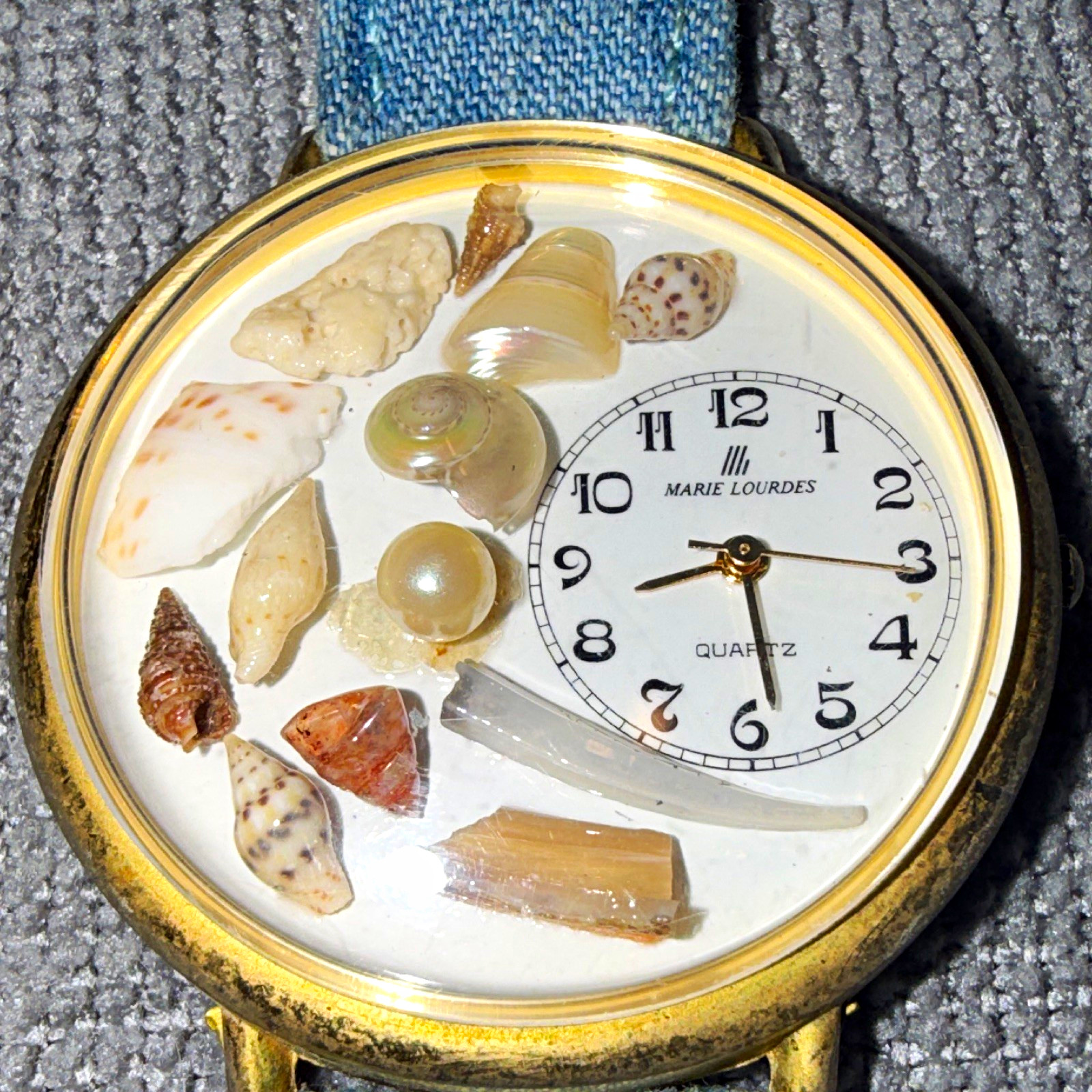 Marie Lourdes Quartz Women’s Analog Watch Seashell Dial Gold Tone Blue Strap
