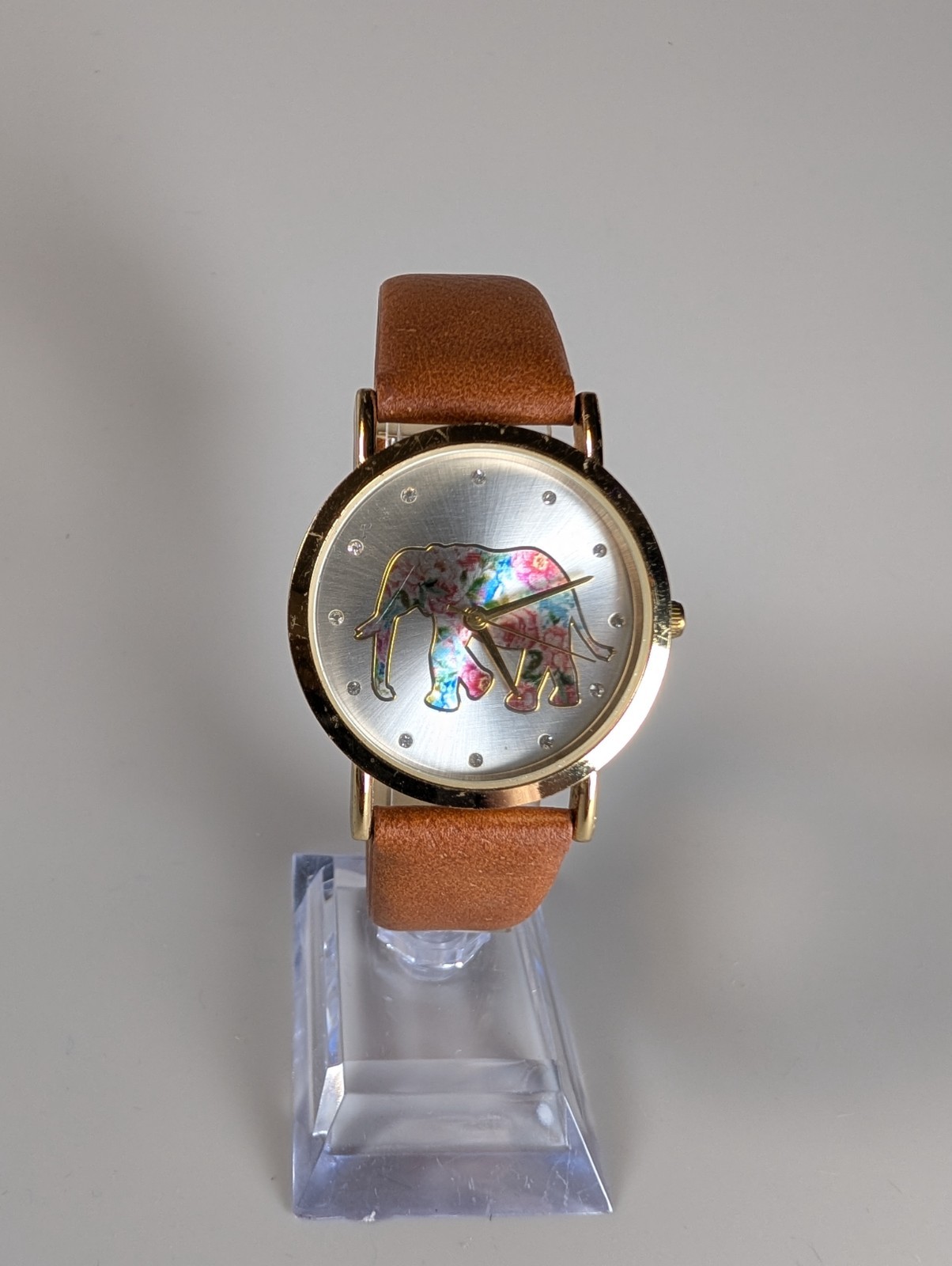 Elephant watch with flower pattern and gold outline and dot indexes brown band