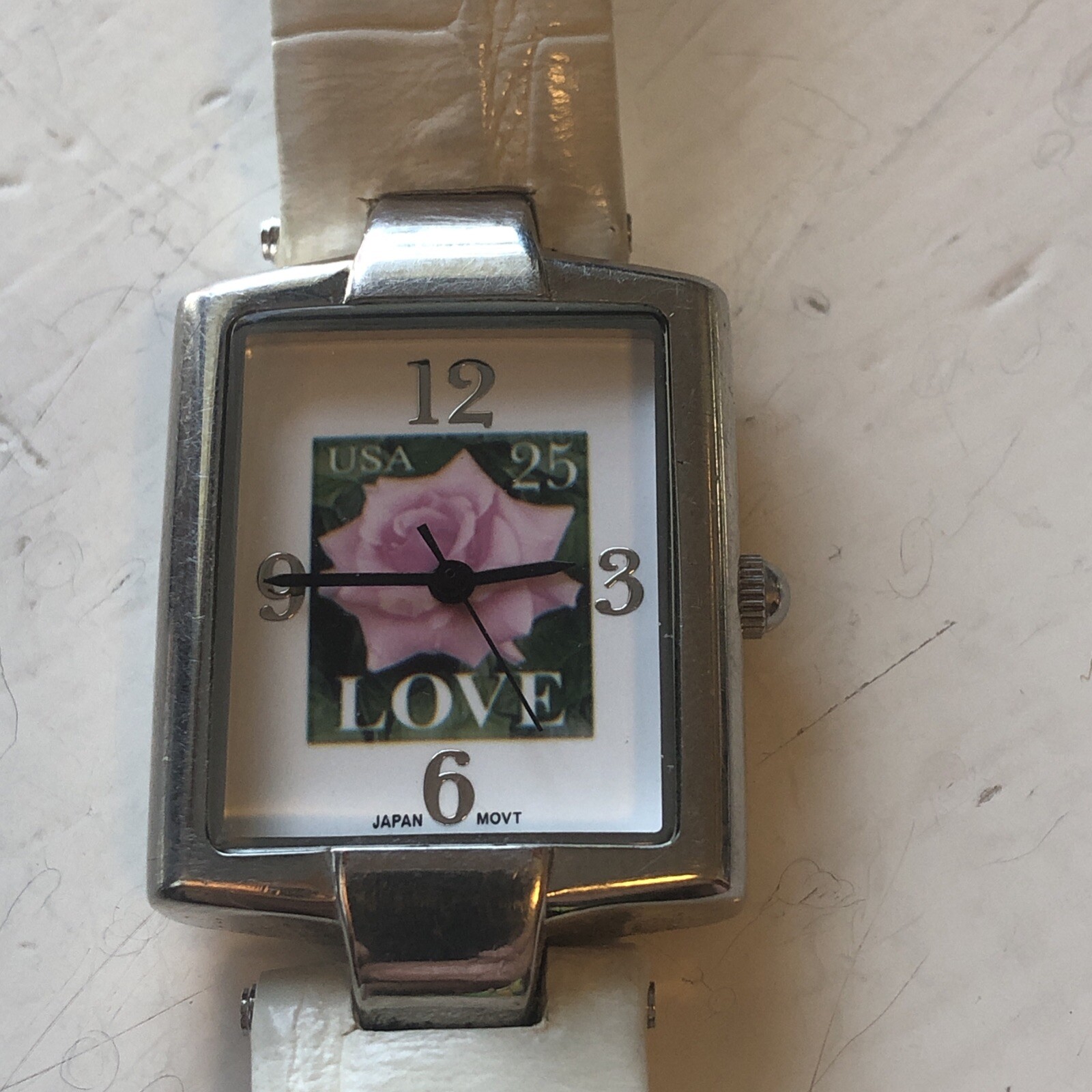 Women’s USPS LOVE Pink Rose 25 Cent Stamp Watch, White Leather NEW BATTERY