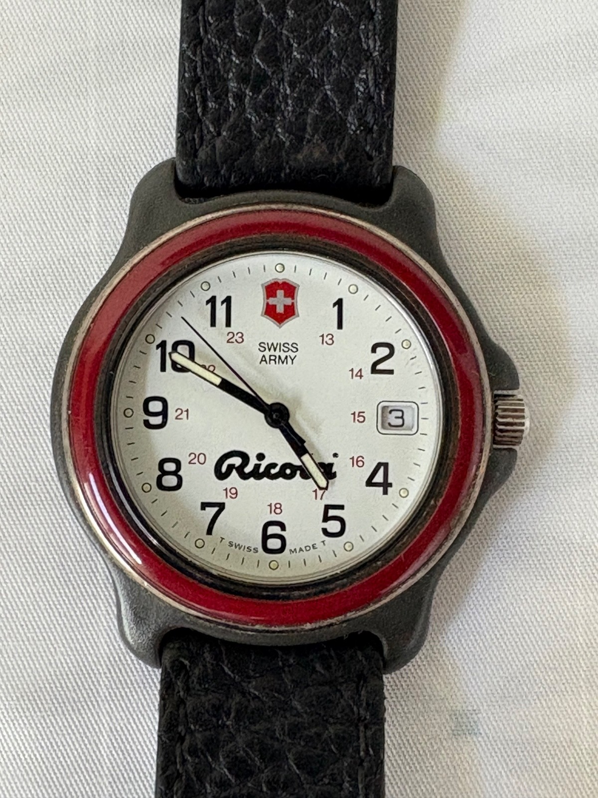 Swiss Army Mens Ricola Logo White Face Date Black Leather Watch Wristband