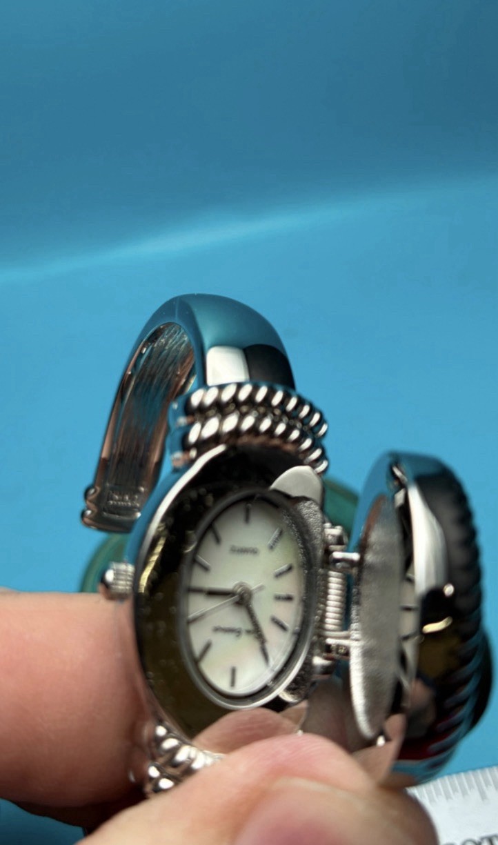 Gem Essence silver-tone watch features a distinct purple druzy stone